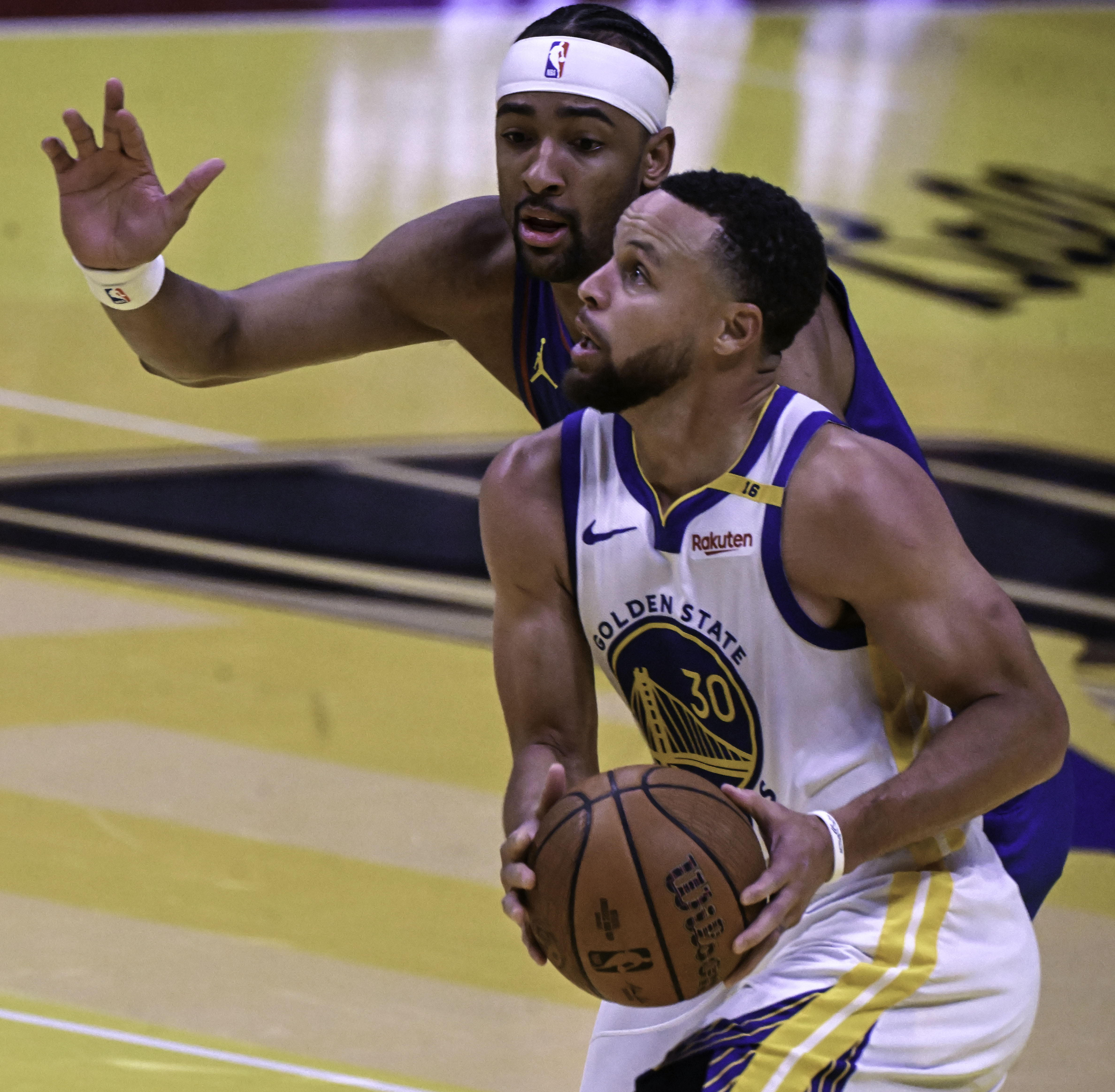Golden State Warriors guard Stephen Curry (30) is defended by Denver Nuggets forward Zeke Nnaji (22) during an Emirates NBA Cup Group Play game at Ball Arena on Tuesday, Dec. 3, 2024. The Nuggets defeated the Warriors 119-115. (Jerilee Bennett,The Gazette)