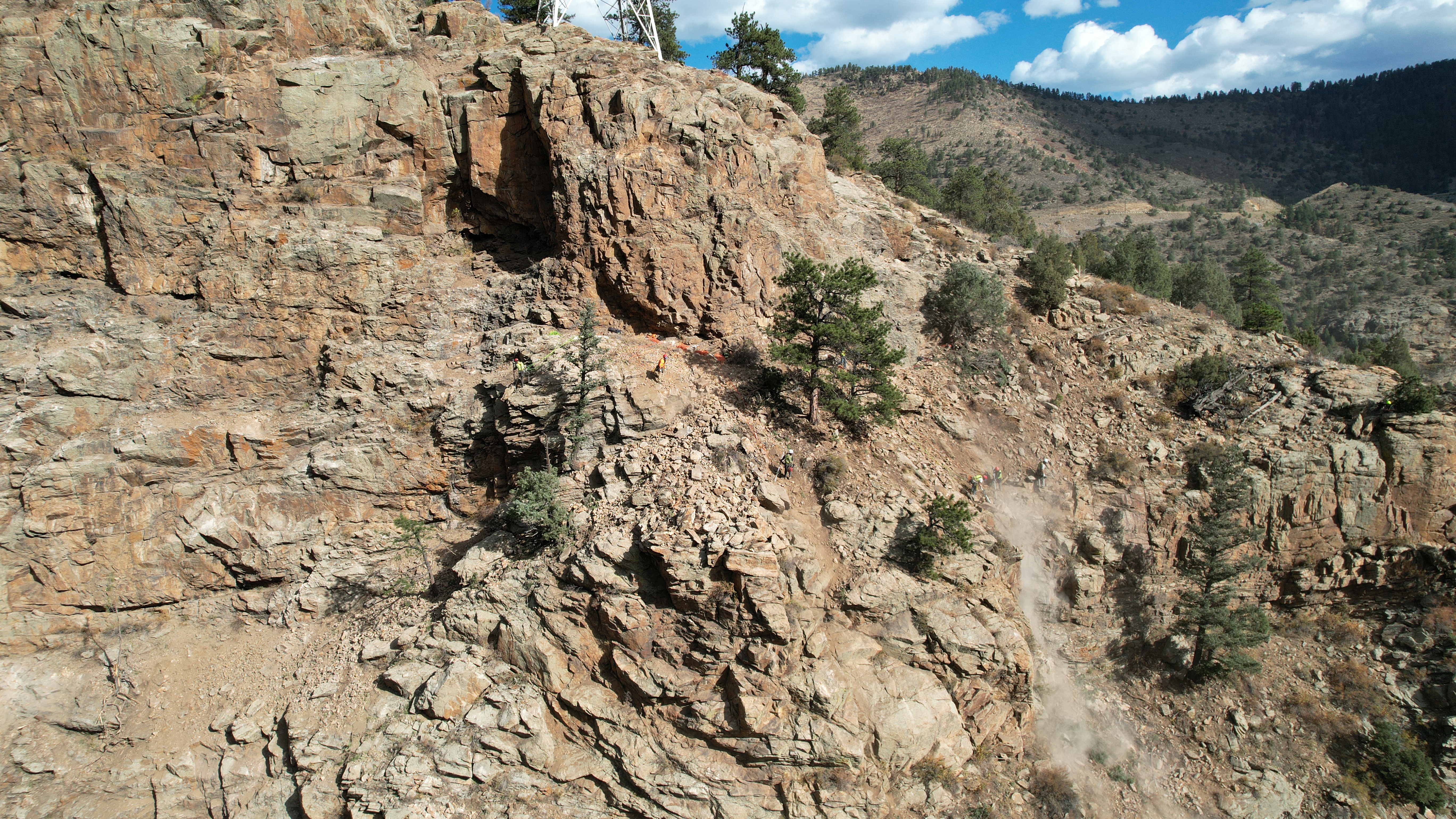 Crews move loose rock during the I-70 Floyd Hill Project. (Courtesy CDOT)