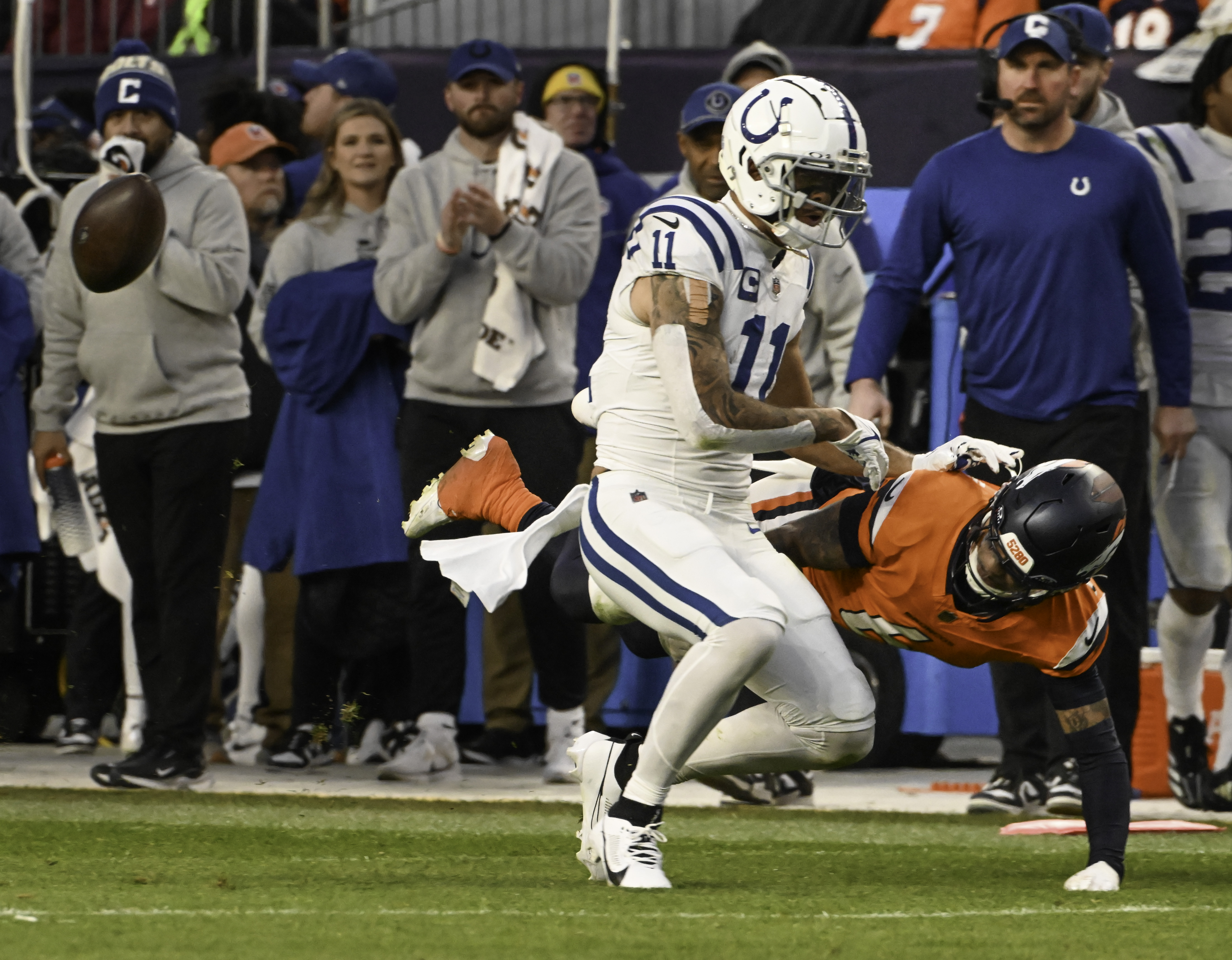 Denver Broncos safety P.J. Locke (6) hits Indianapolis Colts wide receiver Michael Pittman Jr. (11) hard enough to knock the ball out of his hands causing a fumble during the second half of a game against the Colts.The Broncos defeated the Colts 31-13 at Empower Field at Mile High on Sunday, Dec. 15, 2024. (Jerilee Bennett,The Gazette)