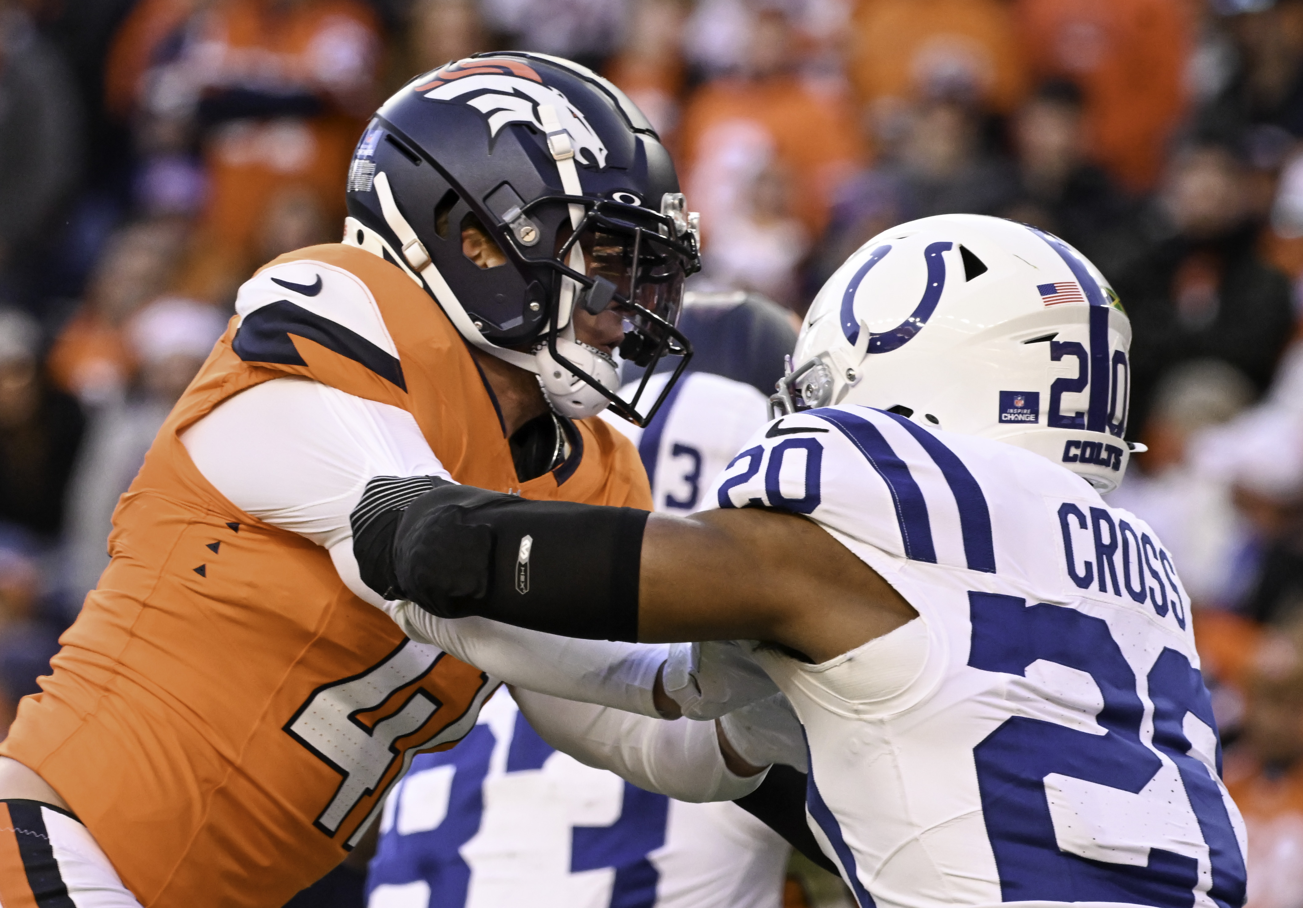 Denver Broncos linebacker Drew Sanders (41) defends Indianapolis Colts safety Nick Cross (20) during a game. The Broncos defeated the Colts 31-13 at Empower Field at Mile High on Sunday, Dec. 15, 2024. (Jerilee Bennett,The Gazette)
