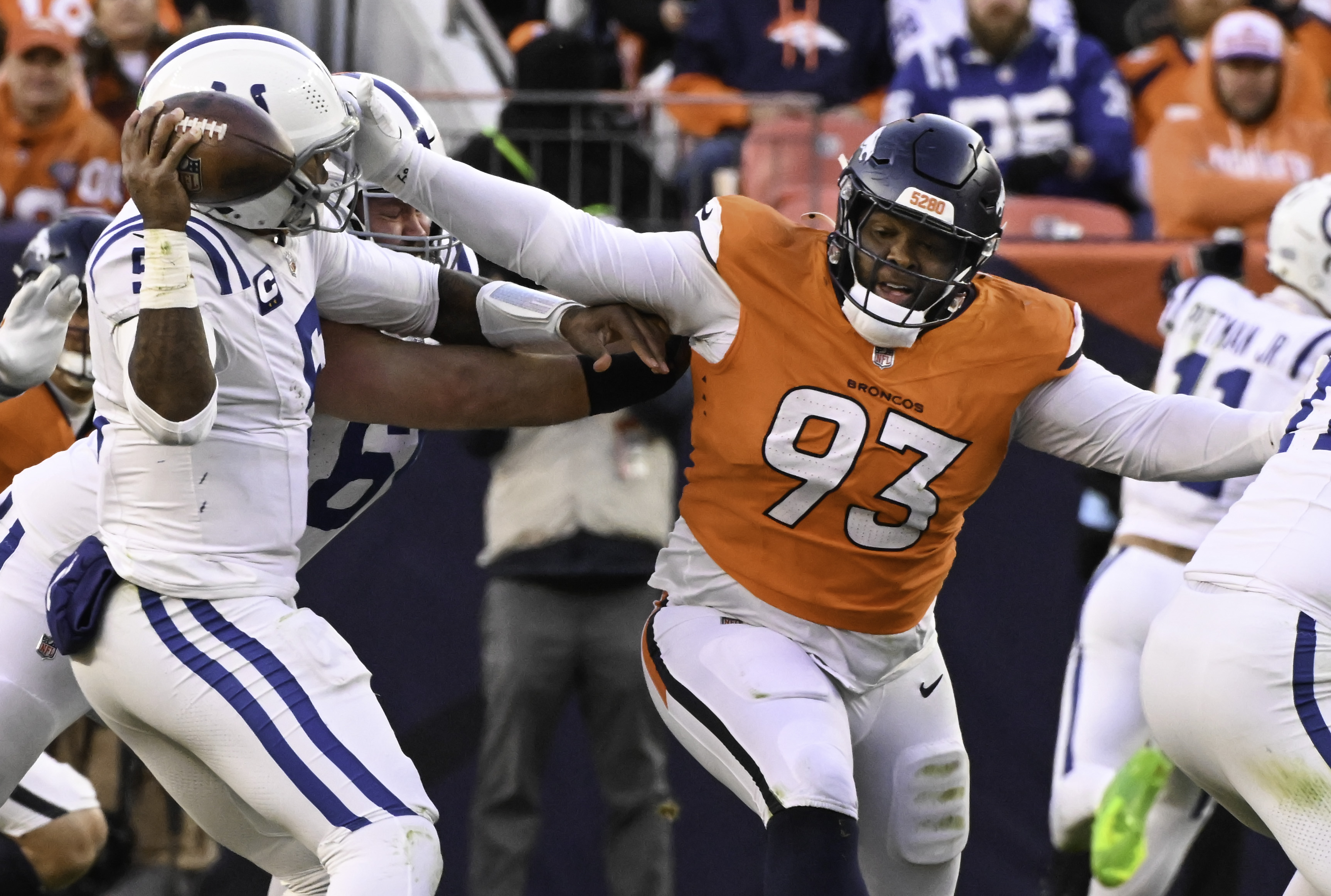 Denver Broncos defensive tackle D.J. Jones (93) gets after Indianapolis Colts quarterback Anthony Richardson (5) during a game. The Broncos defeated the Colts 31-13 at Empower Field at Mile High on Sunday, Dec. 15, 2024. (Jerilee Bennett,The Gazette)