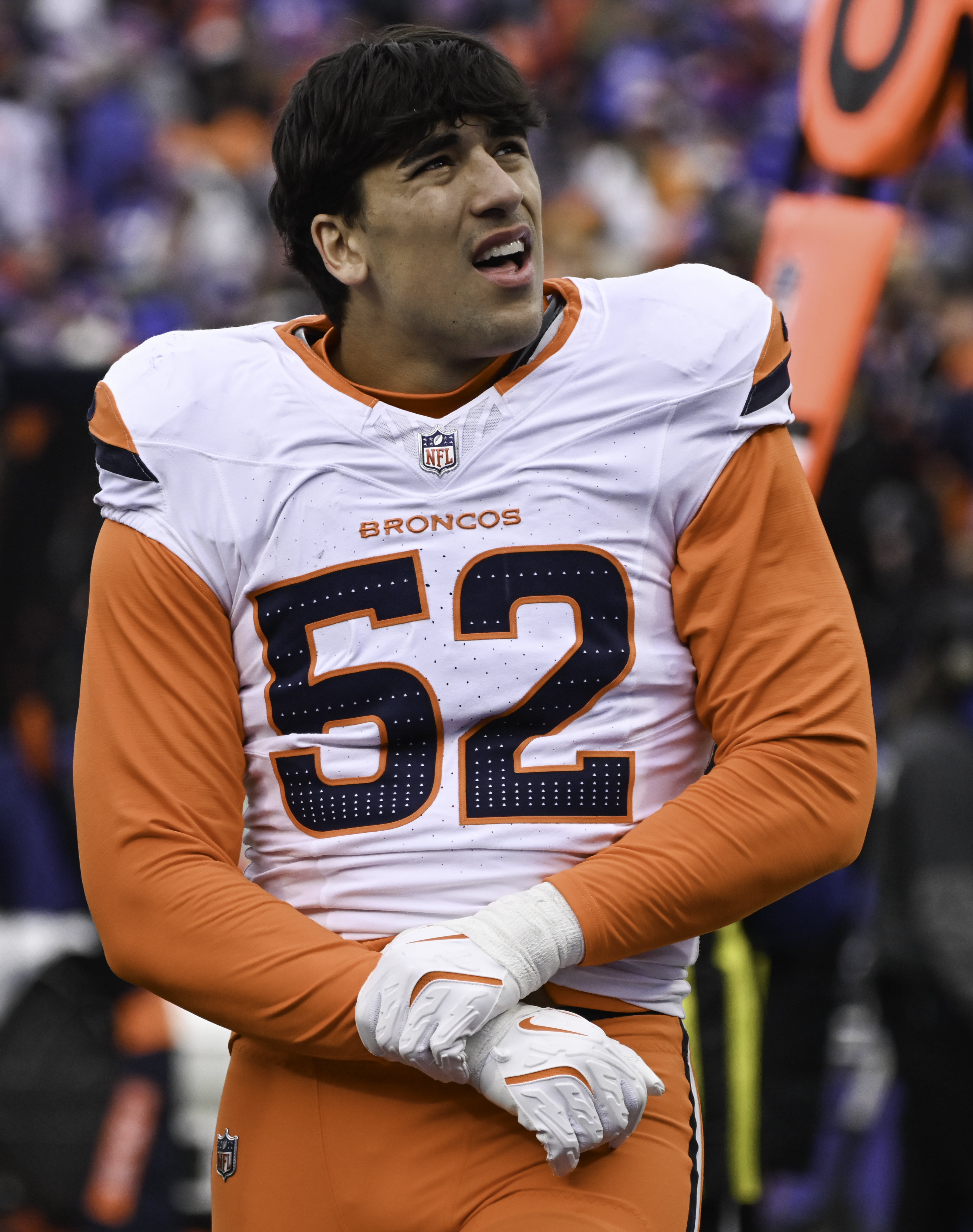 Denver Broncos linebacker Jonah Elliss (52) walks off the field with an injury during the second quarter of the wild card playoff game at Highmark Stadium in Buffalo on Sunday, Jan. 12, 2025. The Broncos lost 31-7. (Jerilee Bennett,The Gazette)