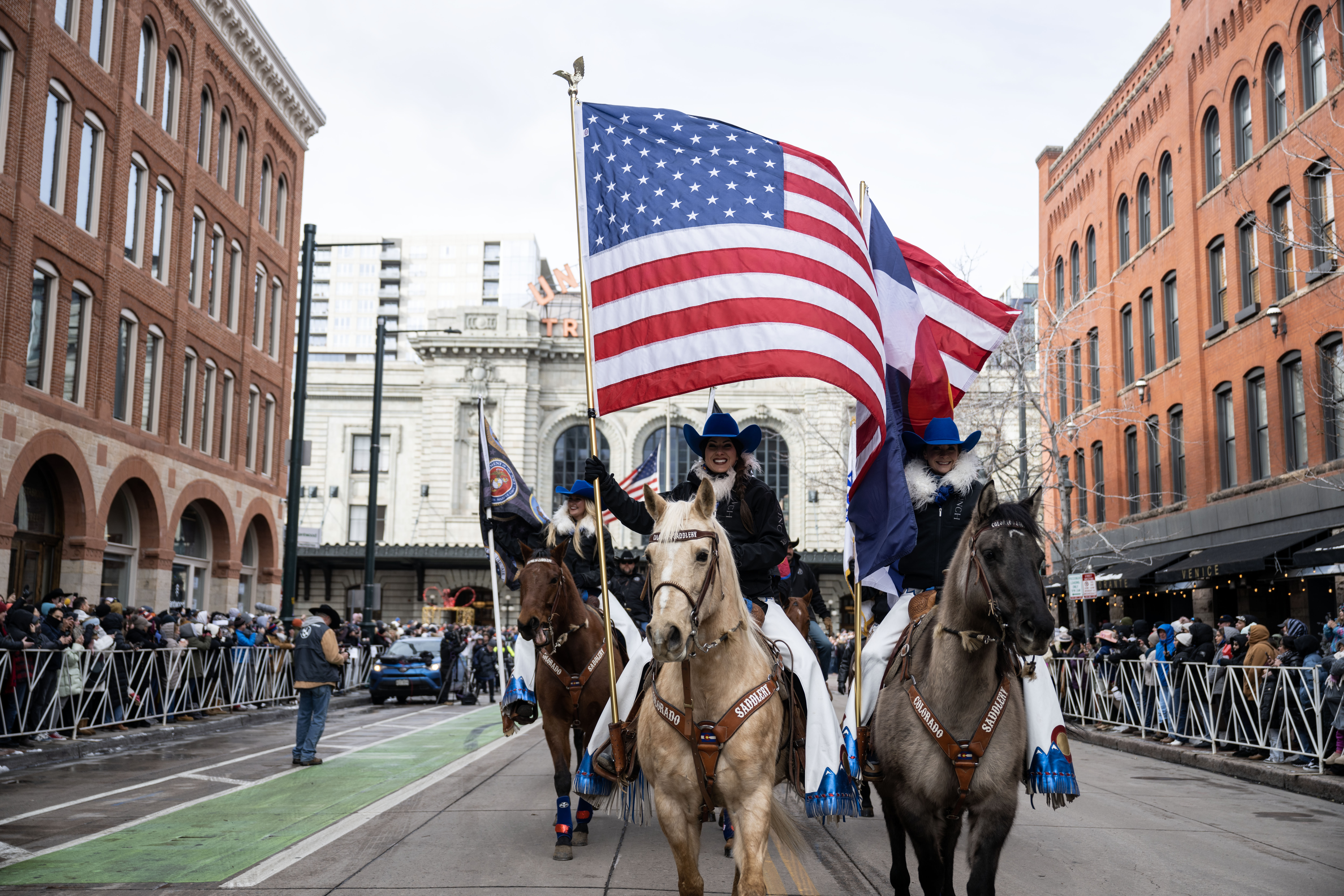 Cowgirls carry national and state flags at the start of the National Western Stock Show opening day parade down 17th street in Denver on Thursday, Jan. 9, 2025. (Stephen Swofford, Denver Gazette) (StephenSwoffordPhotographerstephen.swofford@gazette.comhttps://secure.gravatar.com/avatar/1ddcaf11c5d70eaa58546ddc4e038687?d=mm&r=g)