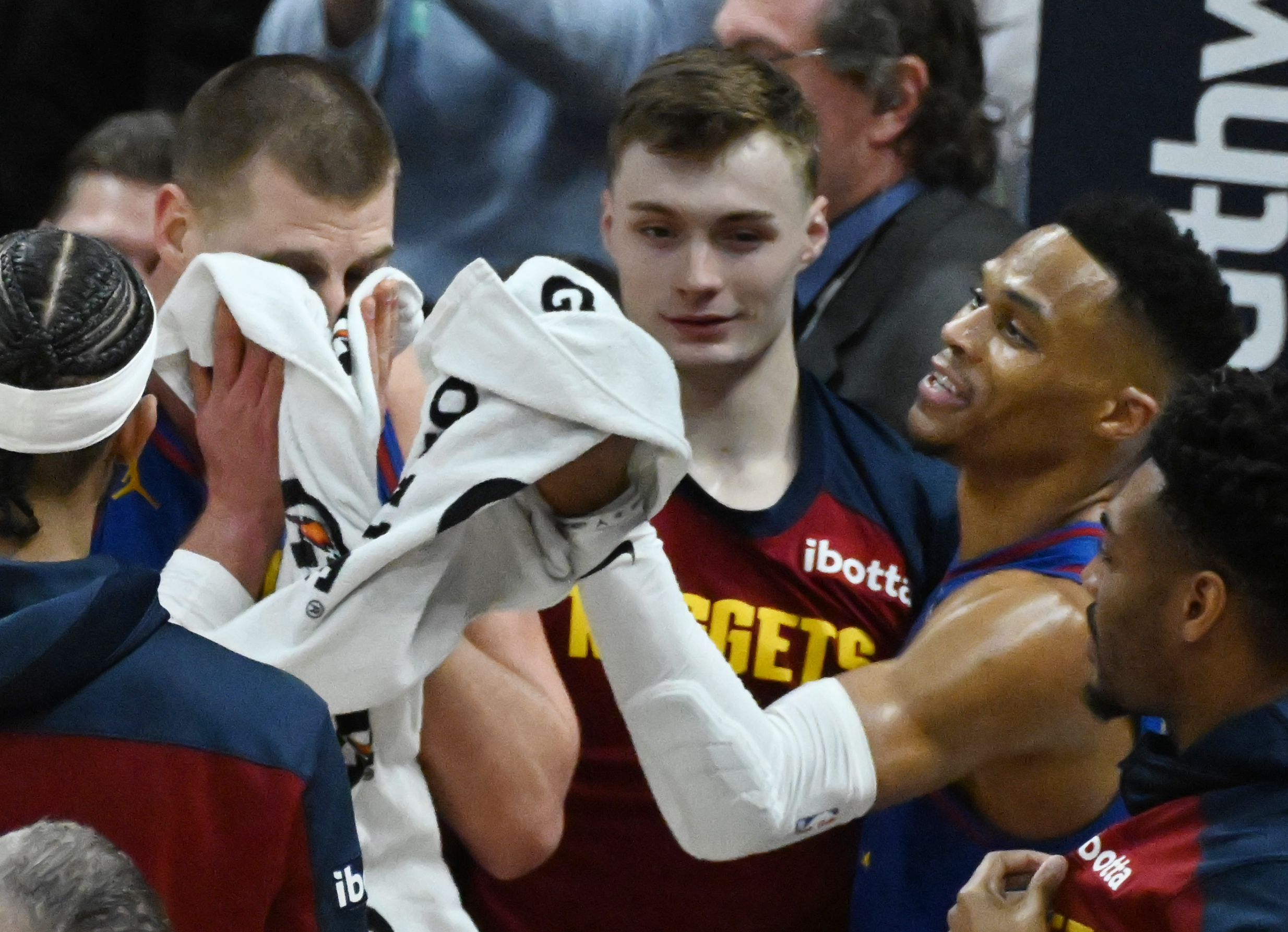 Denver Nuggets guard Russell Westbrook (4) brings a towel to Denver Nuggets center Nikola Jokic (15) after Jokic sunk a buzzer beater at the end of the 3rd quarter from 3/4 court during a game against the Kings at Ball Arena on Thursday, Jan. 23, 2025. (Jerilee Bennett,The Gazette)
