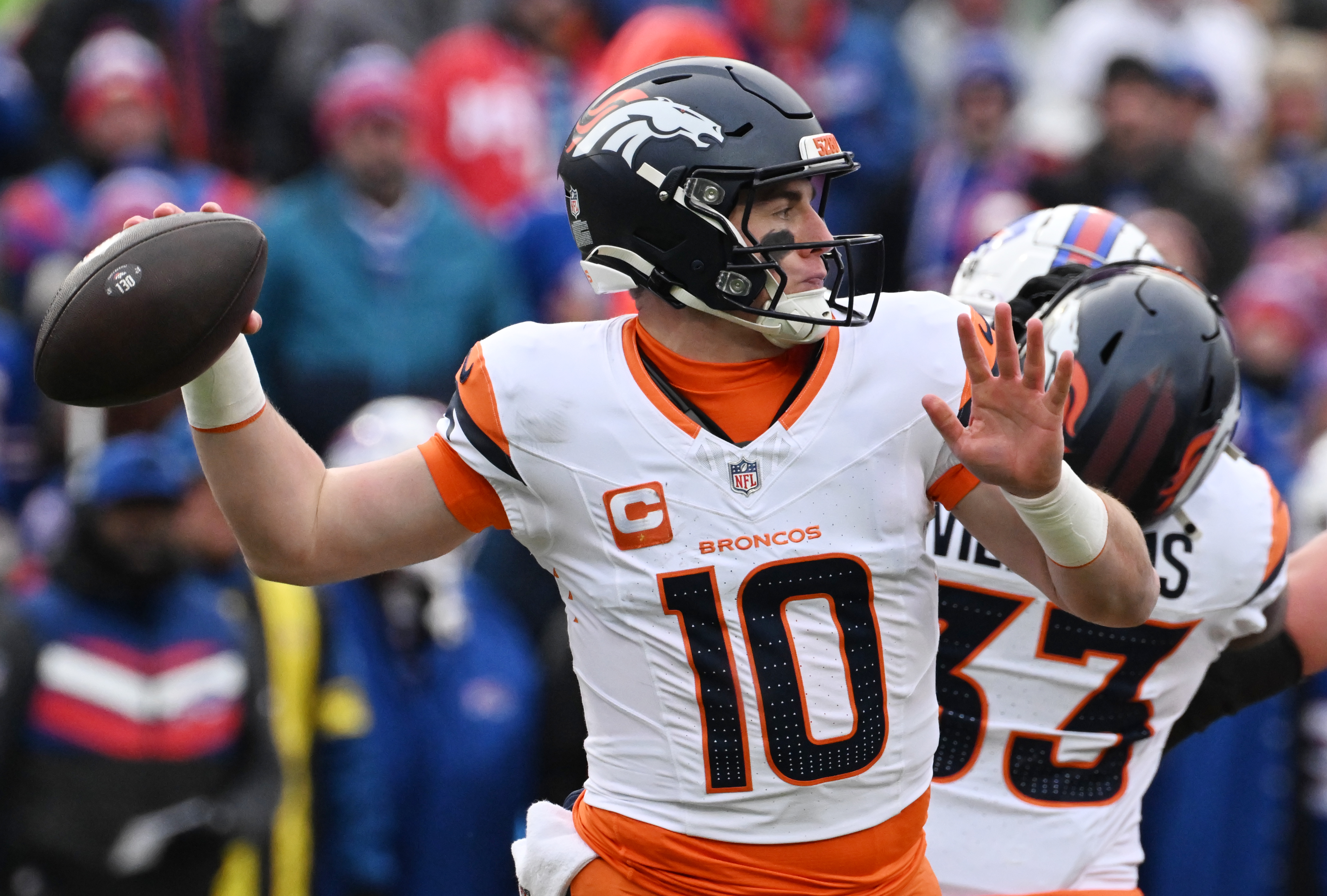 Denver Broncos quarterback Bo Nix (10) throws the ball in the second quarter of the wild card playoff game against the Bills at Highmark Stadium in Buffalo on Sunday, Jan. 12, 2024. (Jerlee Bennett,The Gazette)