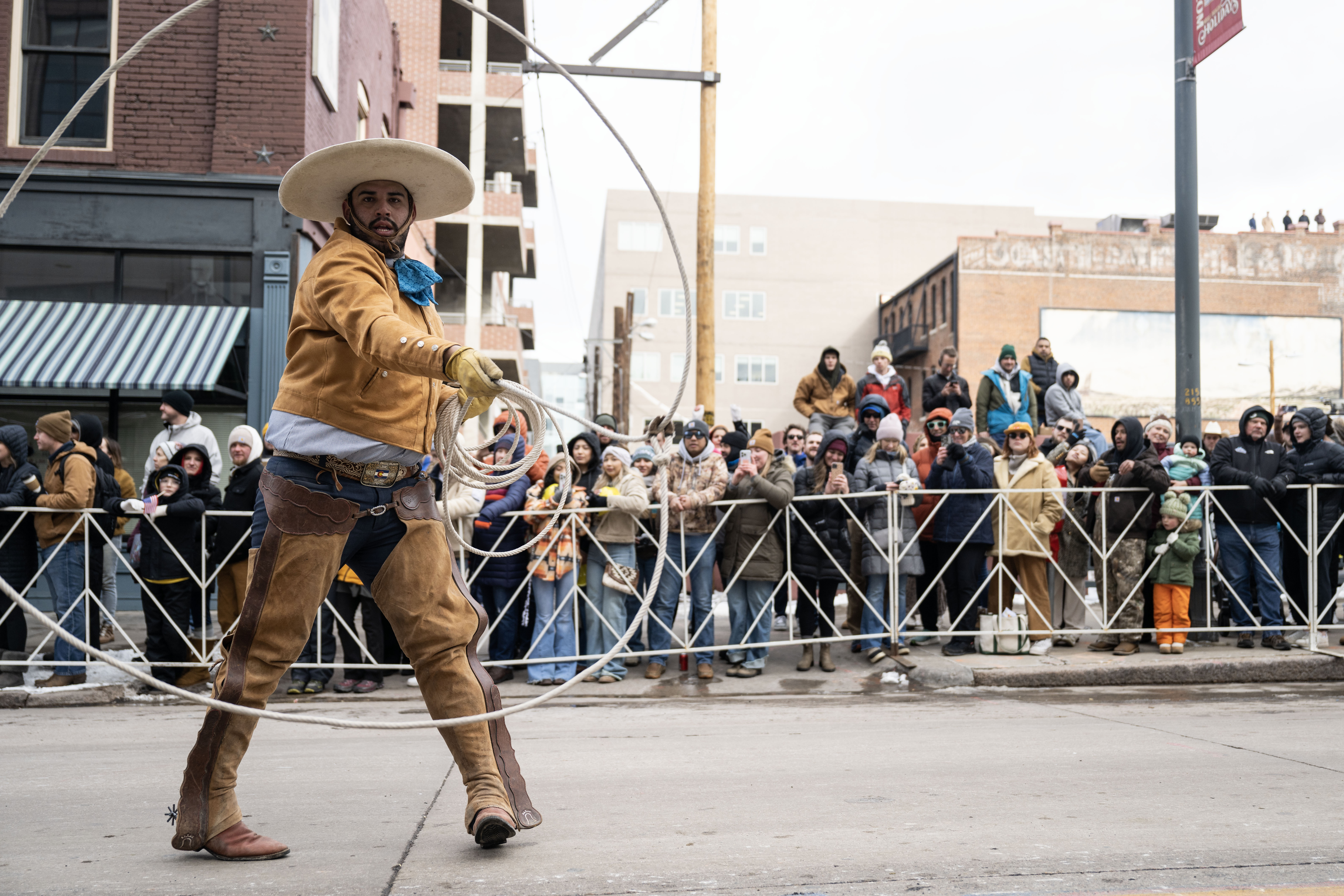 A cowboy shows off his roping skills during the National Western Stock Show opening day Parade down 17th street in Denver on Thursday, Jan. 9, 2025. (Stephen Swofford, Denver Gazette) (StephenSwoffordPhotographerstephen.swofford@gazette.comhttps://secure.gravatar.com/avatar/1ddcaf11c5d70eaa58546ddc4e038687?d=mm&r=g)