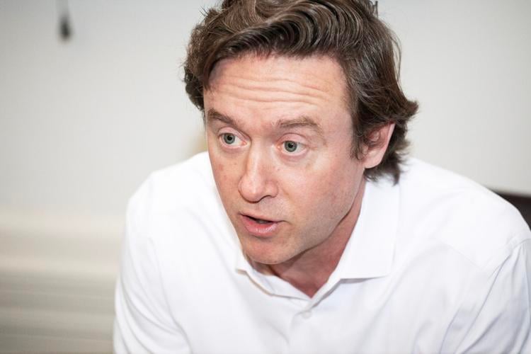 Mayor Mike Johnston addresses members of the media