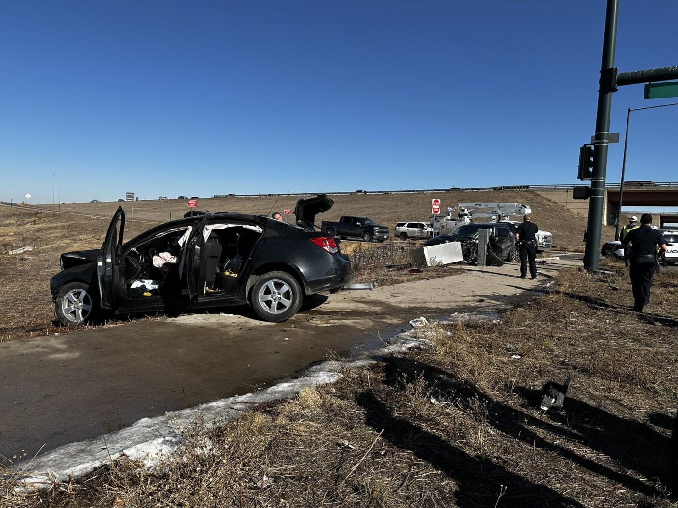 2 arrested after Aurora rolling shootout between cars ends in crash
