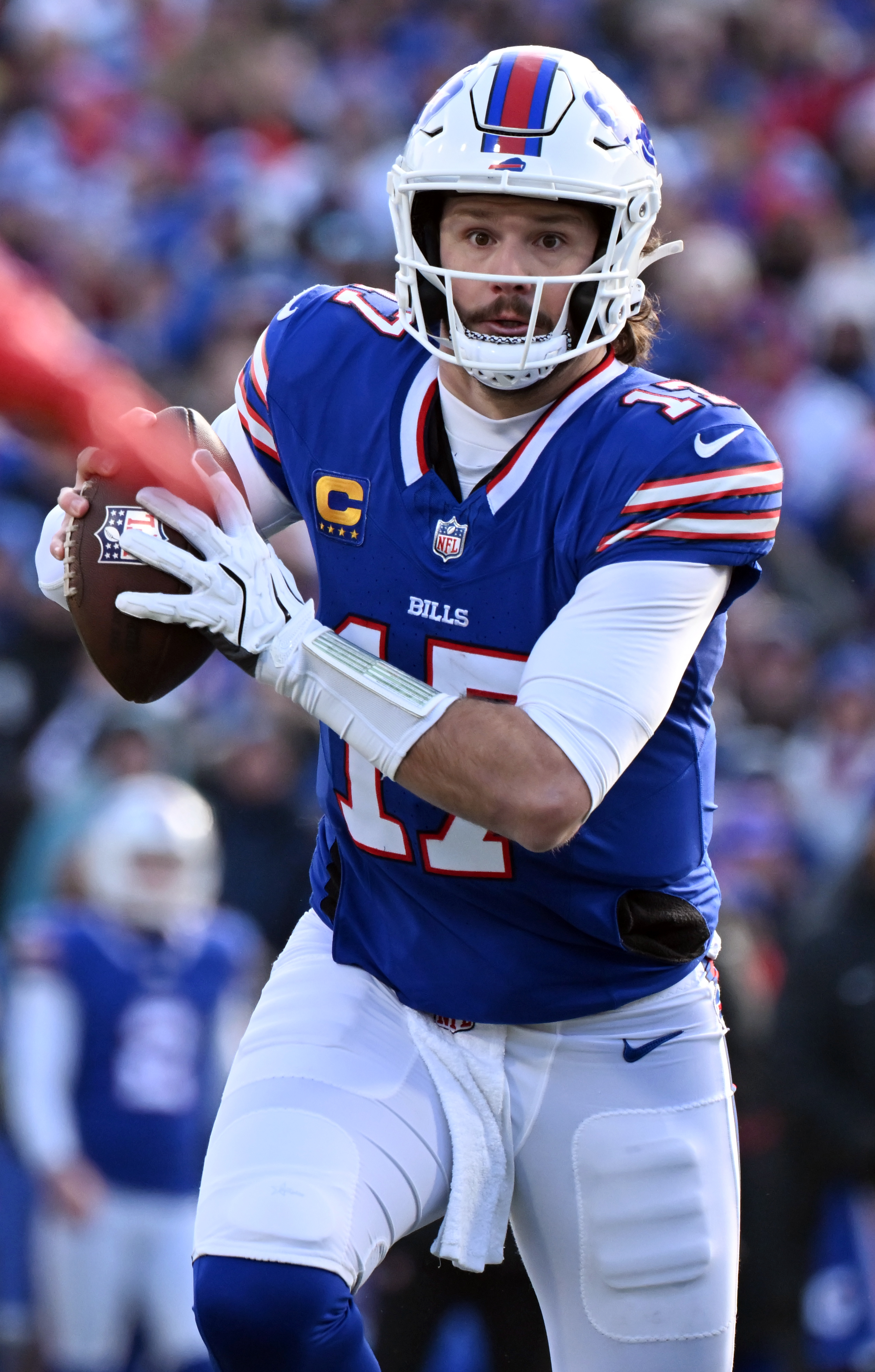 Buffalo Bills quarterback Josh Allen (17) runs with the ball during the wild card playoff game against the Bills in Buffalo on Sunday, January 12, 2024. The Broncos lost the game 31-7. (Jerilee Bennett,The Gazette)