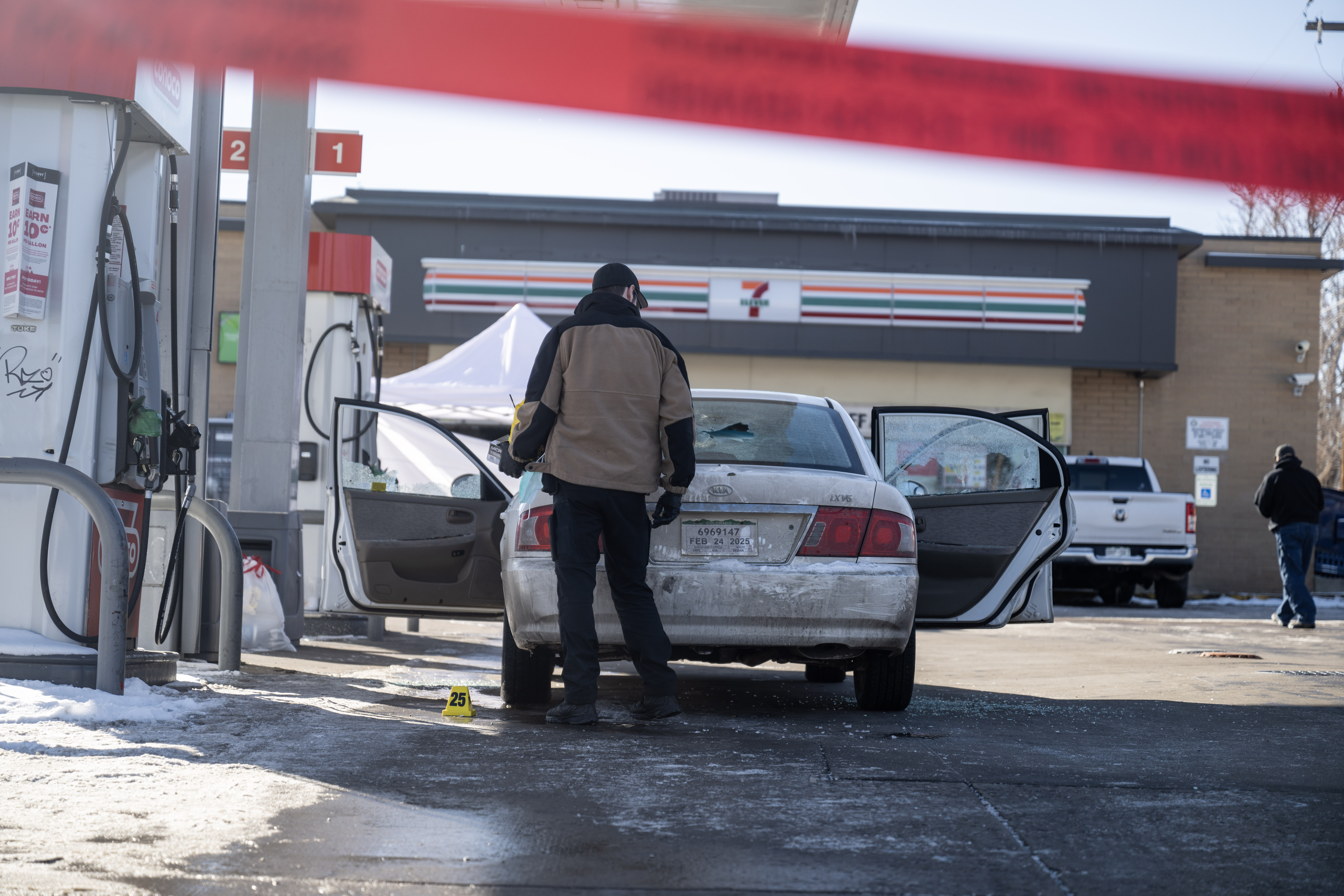 Crime Scene Investigators examine the scene of a shooting at a gas station on the corner of Colorado Blvd and E. 35th Ave in Denver on Monday, Jan. 27, 2025. (Stephen Swofford, Denver Gazette) (StephenSwoffordPhotographerstephen.swofford@gazette.comhttps://secure.gravatar.com/avatar/1ddcaf11c5d70eaa58546ddc4e038687?d=mm&r=g)