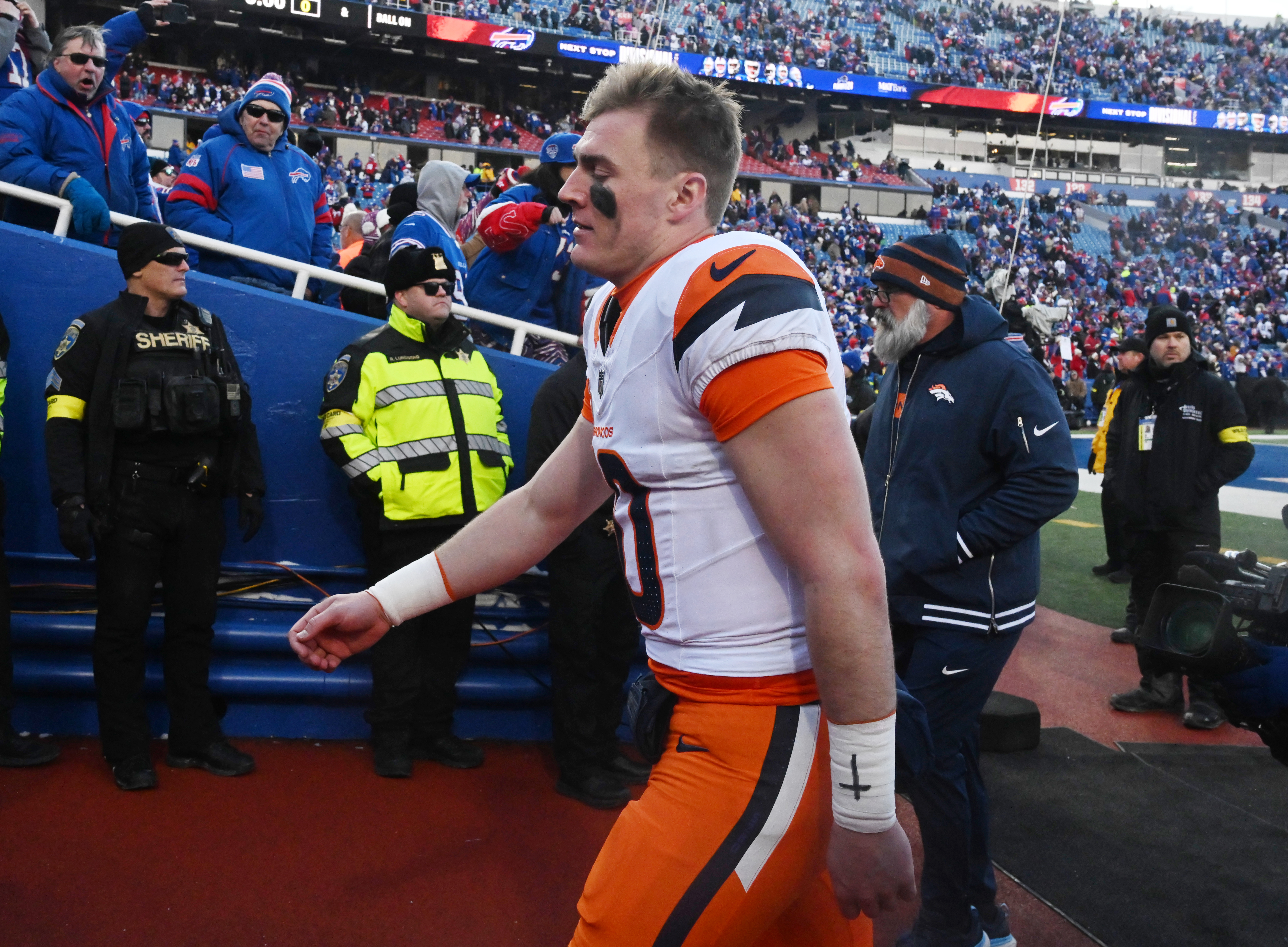 Denver Broncos quarterback Bo Nix (10) exits the field after losing the wild card playoff game at Highmark Stadium in Buffalo on Sunday, Jan. 12, 2025. The Broncos lost 31-7. (Jerilee Bennett,The Gazette)