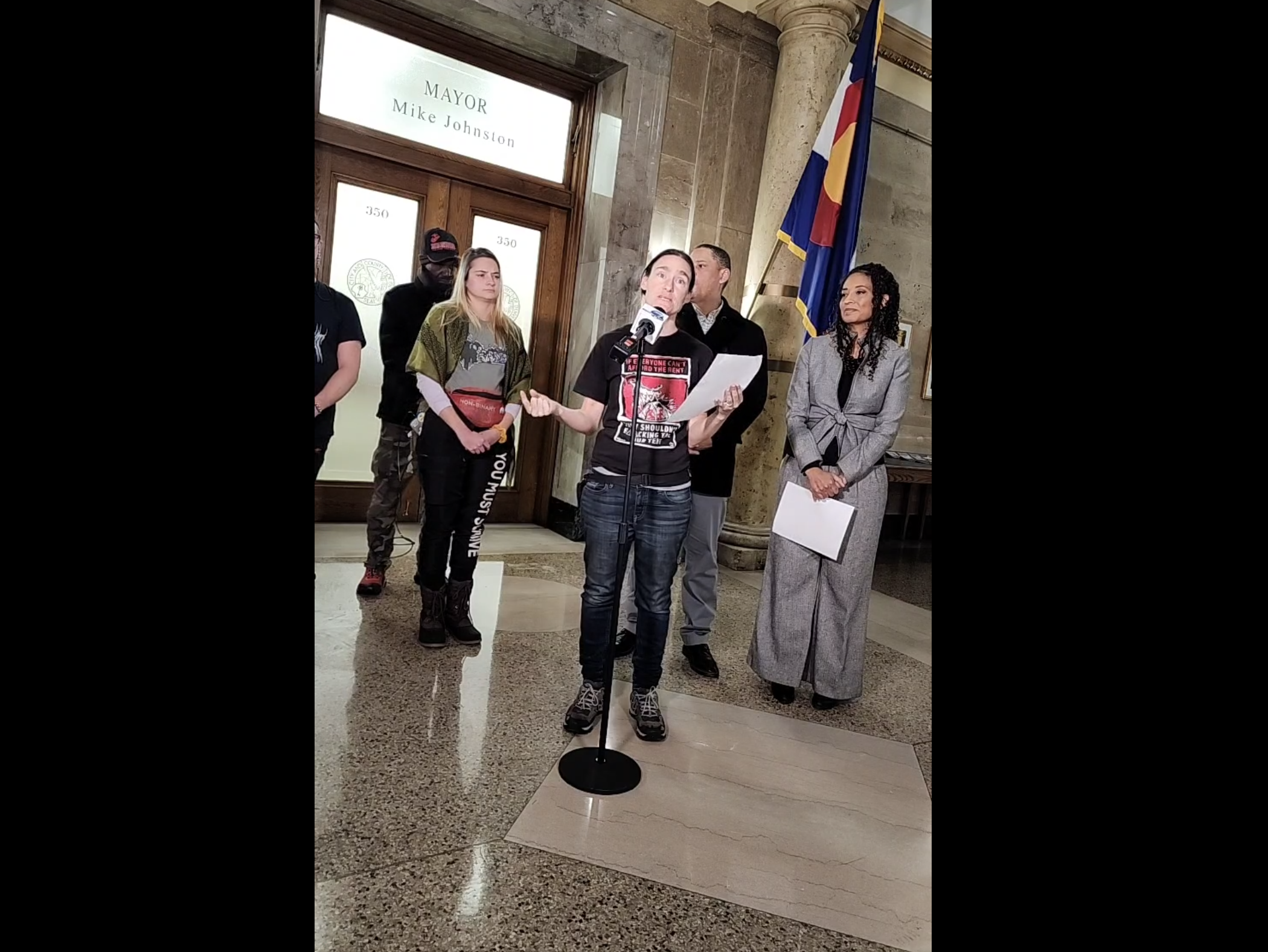 Terese Howard from Housekeys Action Network Denver (HAND) and members of other progressive groups gathered outside Mayor Mike Johnston's office on Monday, Jan. 27, to deliver their reports cards on his efforts to protect 