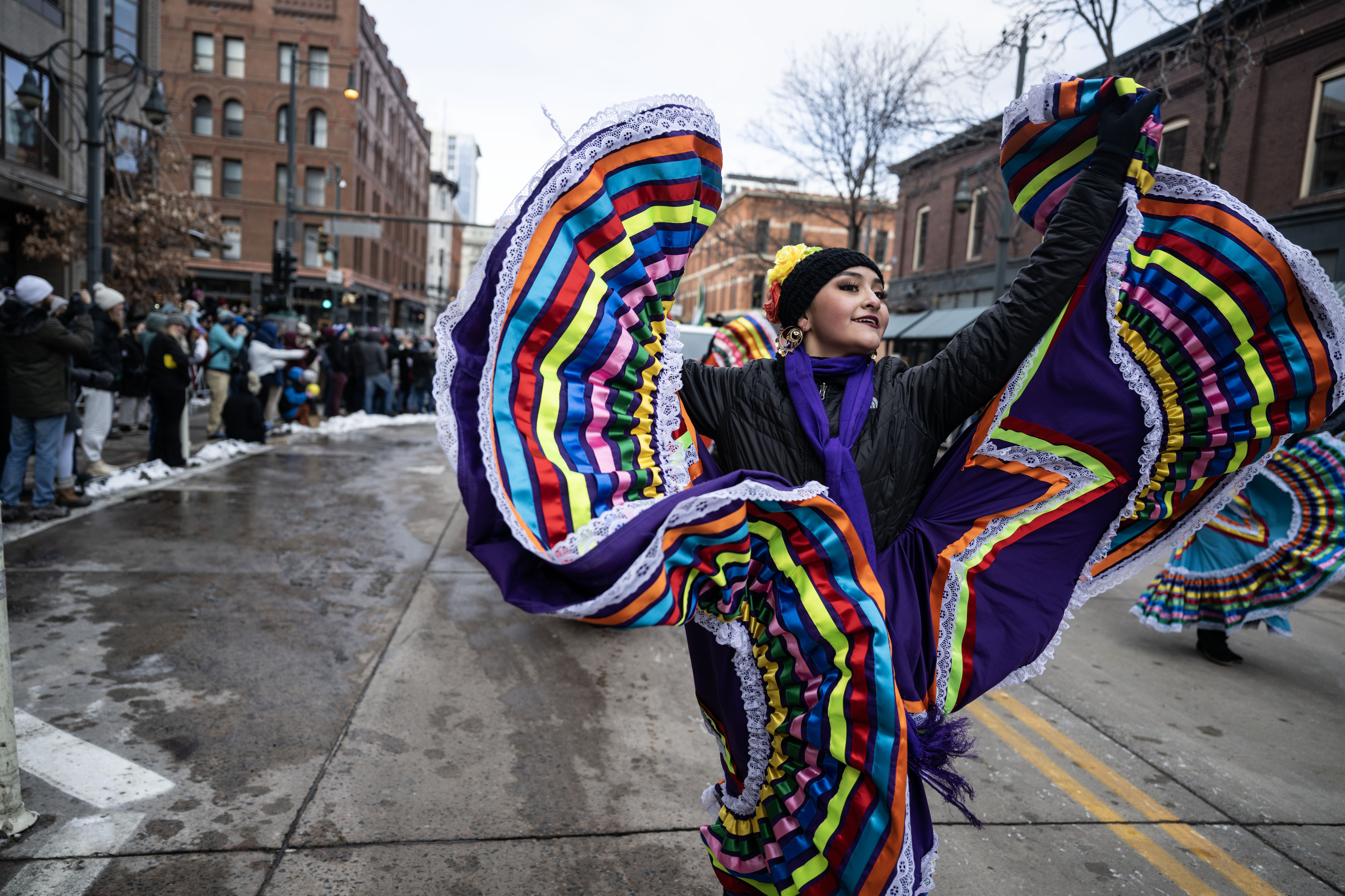 Dancers walk down the street during the National Western Stock Show opening day Parade down 17th street in Denver on Thursday, Jan. 9, 2025. (Stephen Swofford, Denver Gazette) (StephenSwoffordPhotographerstephen.swofford@gazette.comhttps://secure.gravatar.com/avatar/1ddcaf11c5d70eaa58546ddc4e038687?d=mm&r=g)