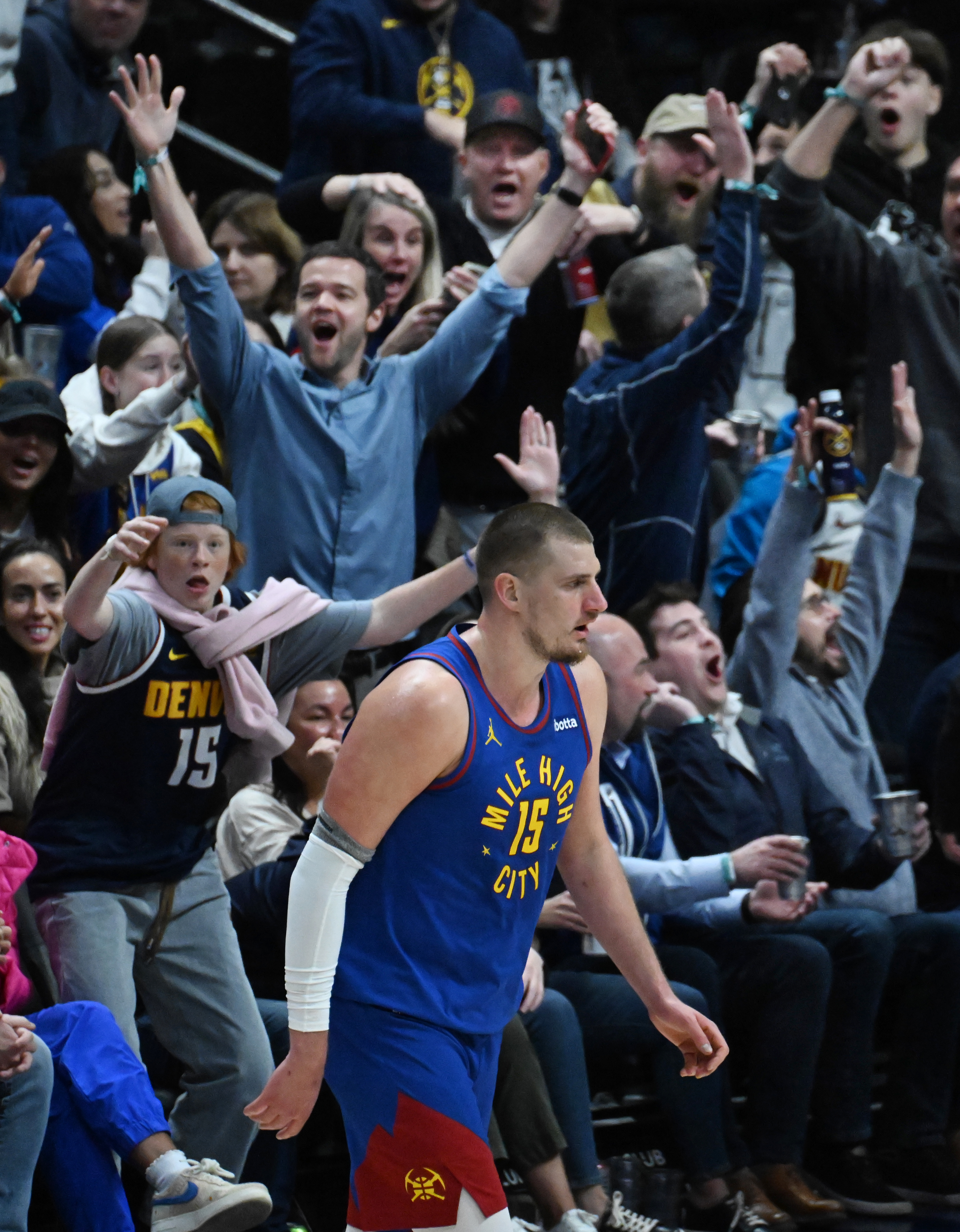 Nuggets fans erupt as Denver Nuggets center Nikola Jokic (15) walks nonchalantly off the court after sinking a buzzer beater at the end of the 3rd quarter from 3/4 court during a game against the Kings at Ball Arena on Thursday, Jan. 23, 2025. (Jerilee Bennett,The Gazette)