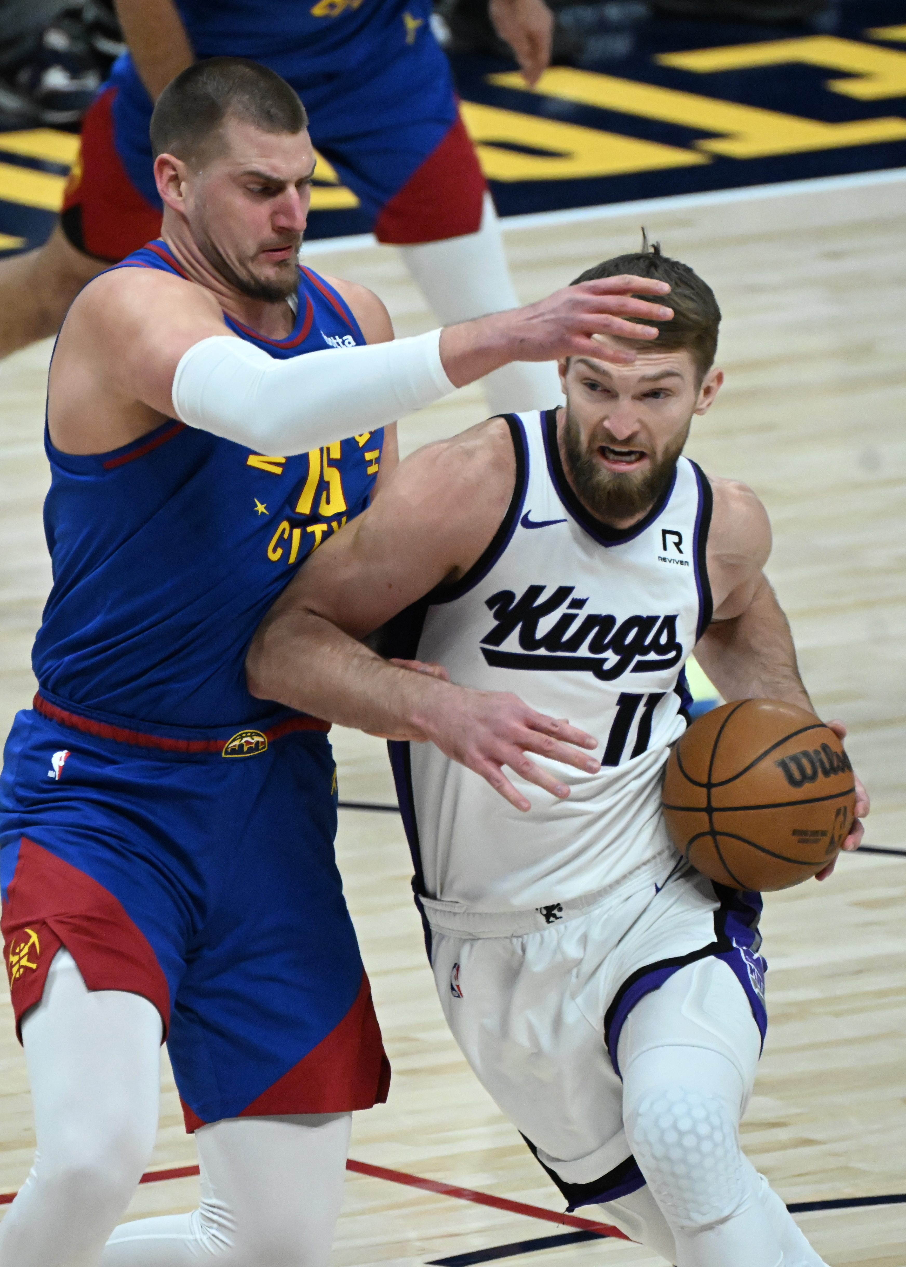Denver Nuggets center Nikola Jokic (15) defends Sacramento Kings forward Domantas Sabonis (11) during the first quarter of a game at Ball Arena on Thursday, Jan. 23, 2025. (Jerilee Bennett,The Gazette)