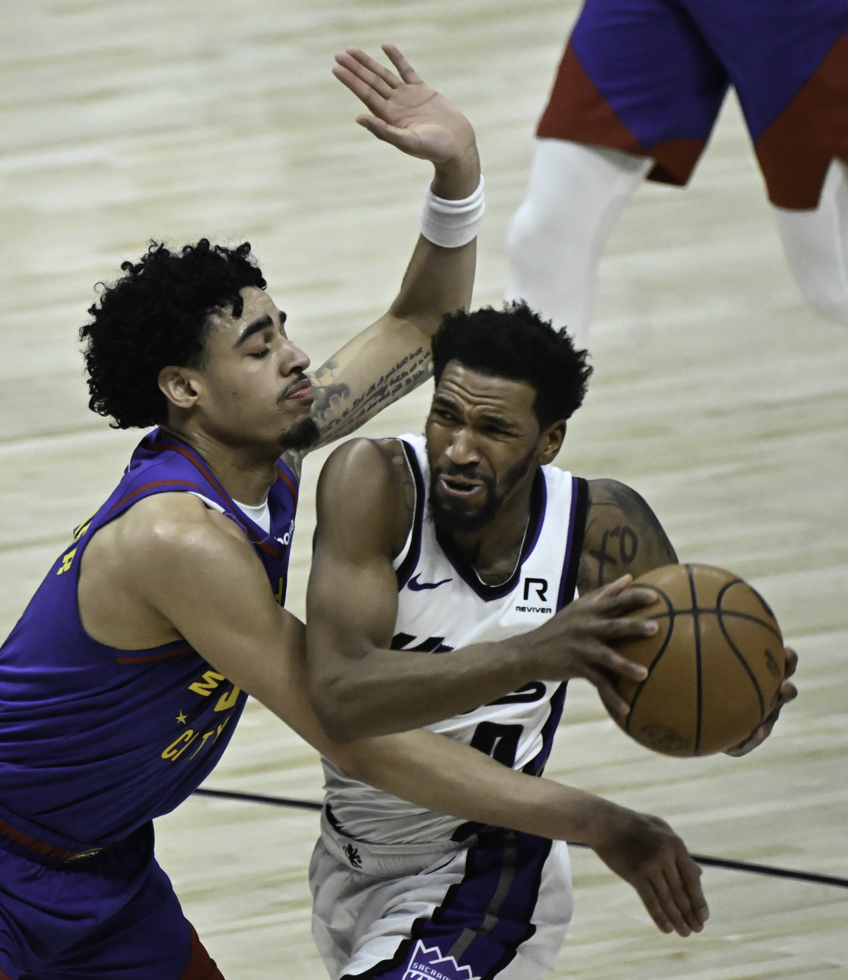 Denver Nuggets guard Julian Strawther (3) defends Sacramento Kings guard Malik Monk (0) goes up for a shot during the second quarter of a game at Ball Arena on Thursday, Jan. 23, 2025. (Jerilee Bennett,The Gazette)