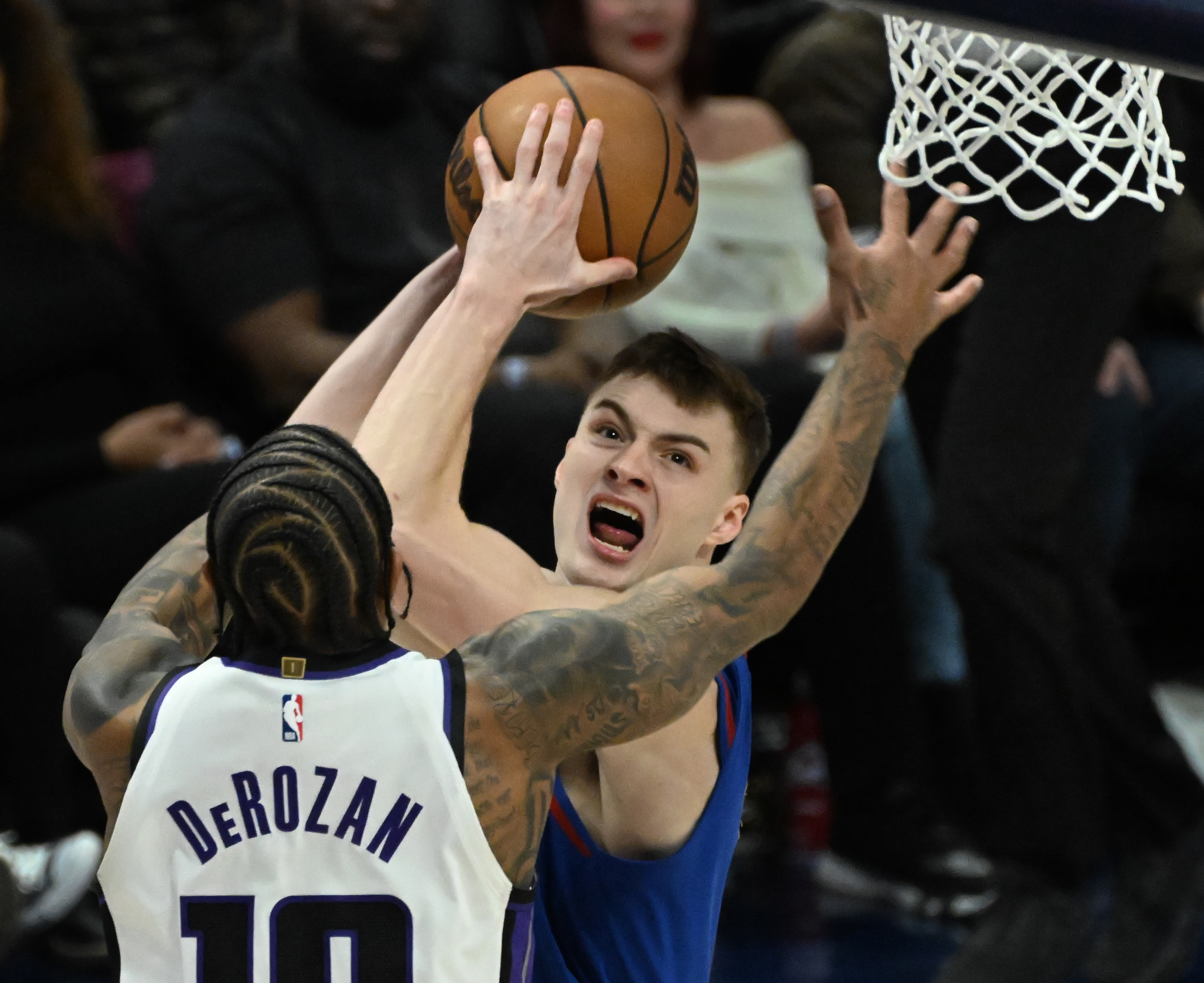 Denver Nuggets guard Christian Braun (0) goes up for a shot over Sacramento Kings forward DeMar DeRozan (10) during game at Ball Arena on Thursday, Jan. 23, 2025. The Nuggets defeated the Kings 132-123. (Jerilee Bennett,The Gazette)