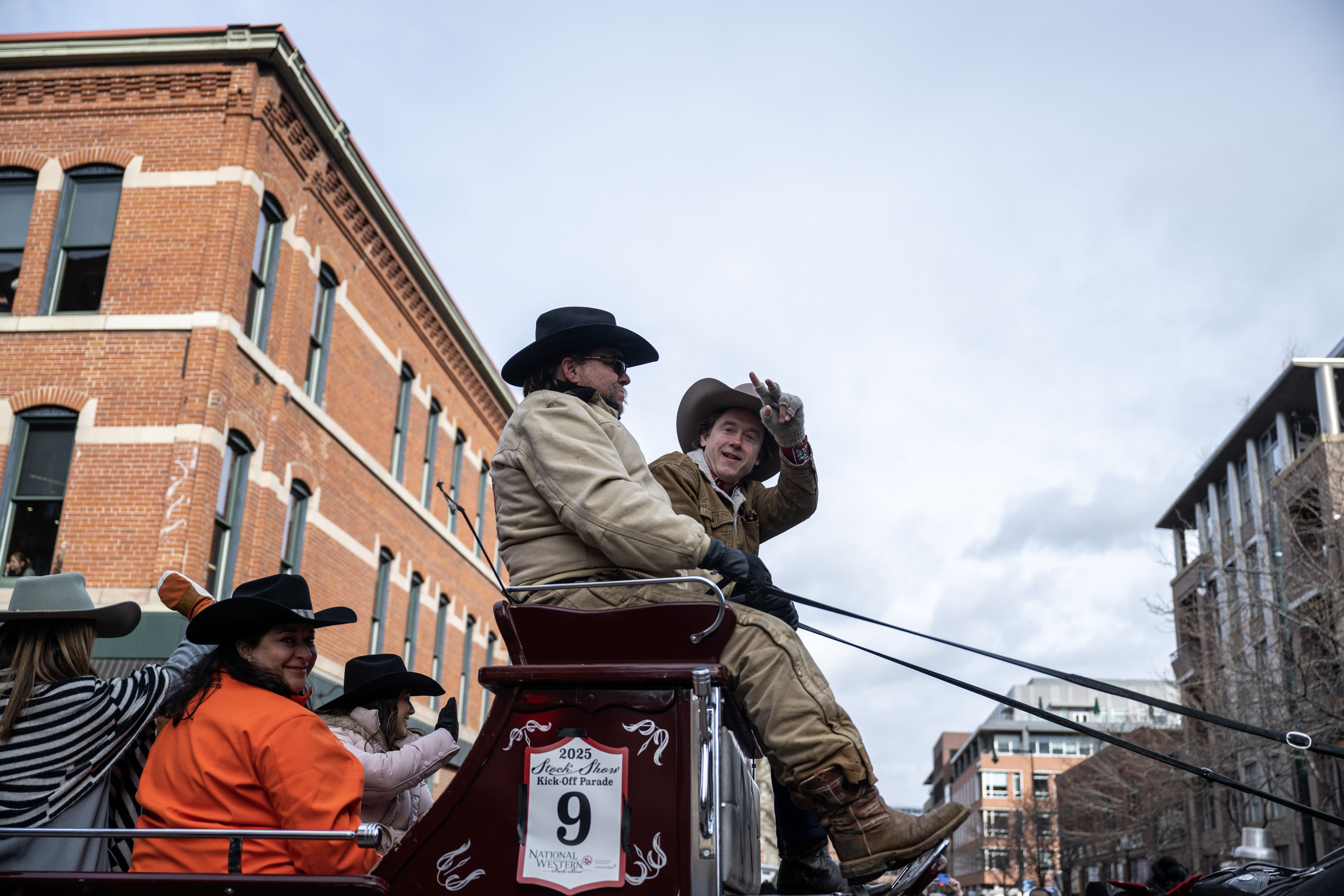 Denver Mayor Mike Johnston waves to the crowd during the National Western Stock Show opening day Parade down 17th street in Denver on Thursday, Jan. 9, 2025. (Stephen Swofford, Denver Gazette) (StephenSwoffordPhotographerstephen.swofford@gazette.comhttps://secure.gravatar.com/avatar/1ddcaf11c5d70eaa58546ddc4e038687?d=mm&r=g)