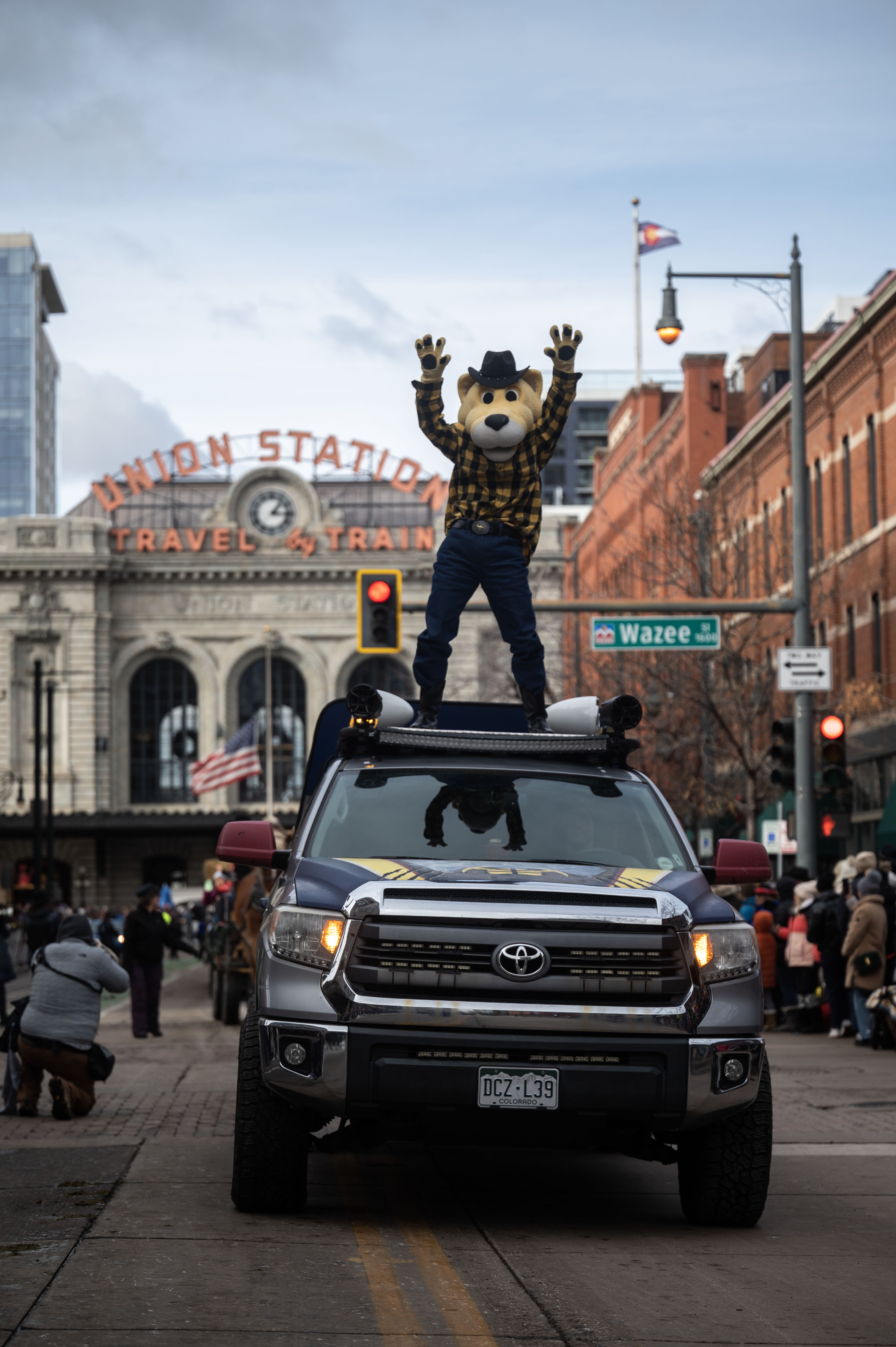 Rocky, the Nuggets mascot, shows off for the crowd as he rides on top of a car during the National Western Stock Show opening day Parade down 17th street in Denver on Thursday, Jan. 9, 2025. (Stephen Swofford, Denver Gazette) (StephenSwoffordPhotographerstephen.swofford@gazette.comhttps://secure.gravatar.com/avatar/1ddcaf11c5d70eaa58546ddc4e038687?d=mm&r=g)