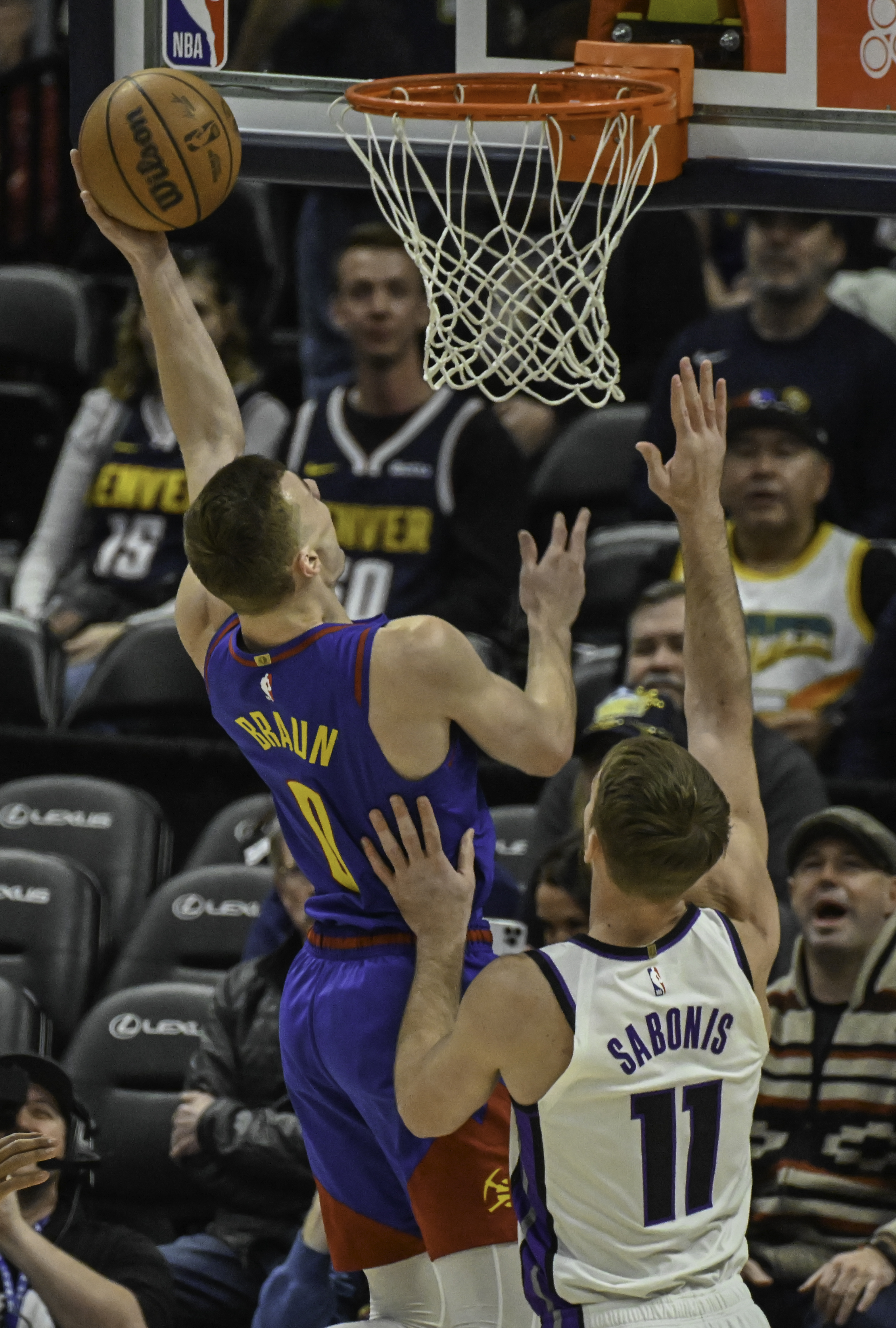 Denver Nuggets guard Christian Braun (0) goes up for a shot during the 2nd quarter from 3/4 court during a game against the Kings at Ball Arena on Thursday, Jan. 23, 2025. (Jerilee Bennett, The Gazette)