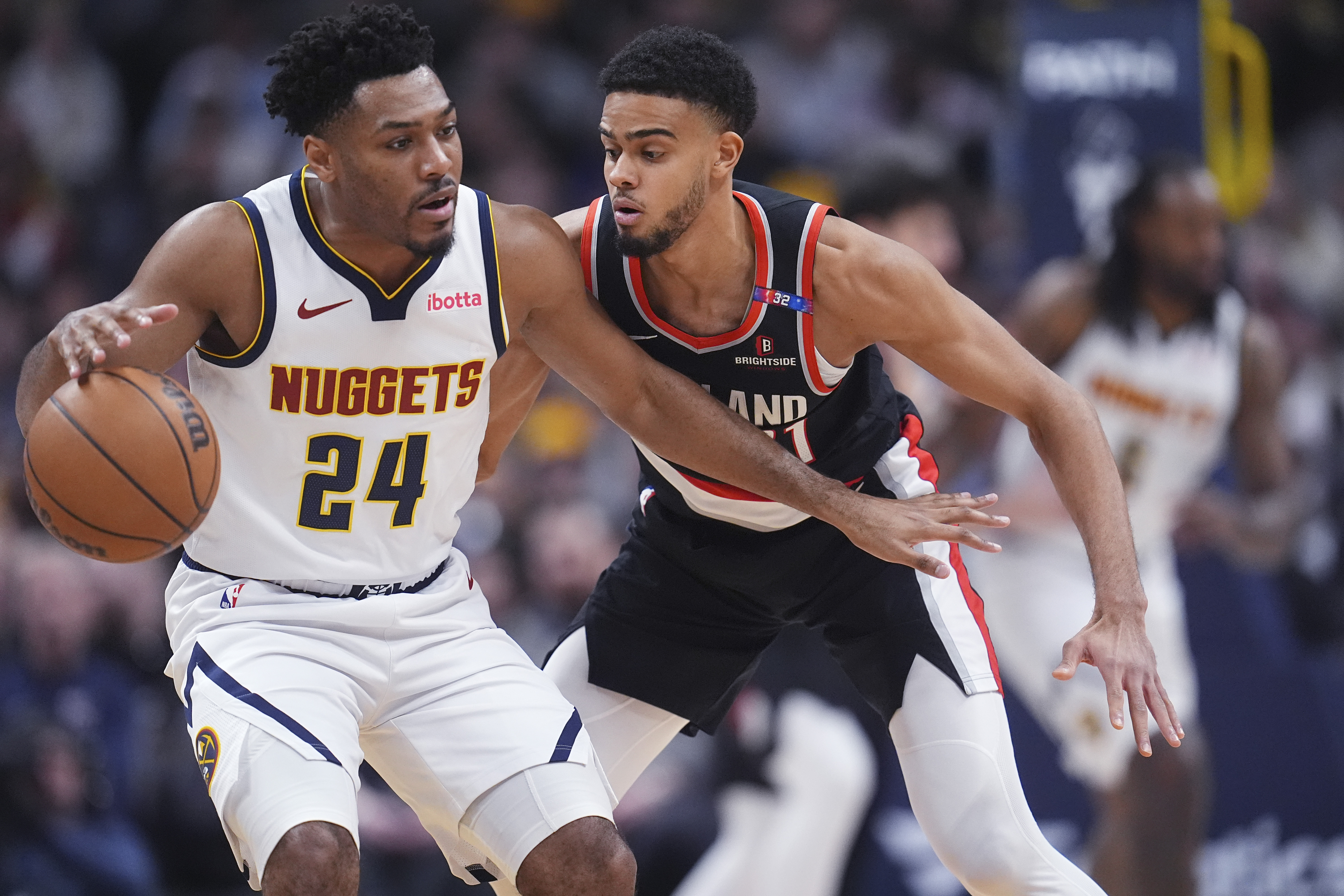 Denver Nuggets guard Jalen Pickett, left, protects the ball as Portland Trail Blazers guard Rayan Rupert defends in the second half of an NBA basketball game Monday, Feb. 10, 2025, in Denver. (AP Photo/David Zalubowski) (David Zalubowski)