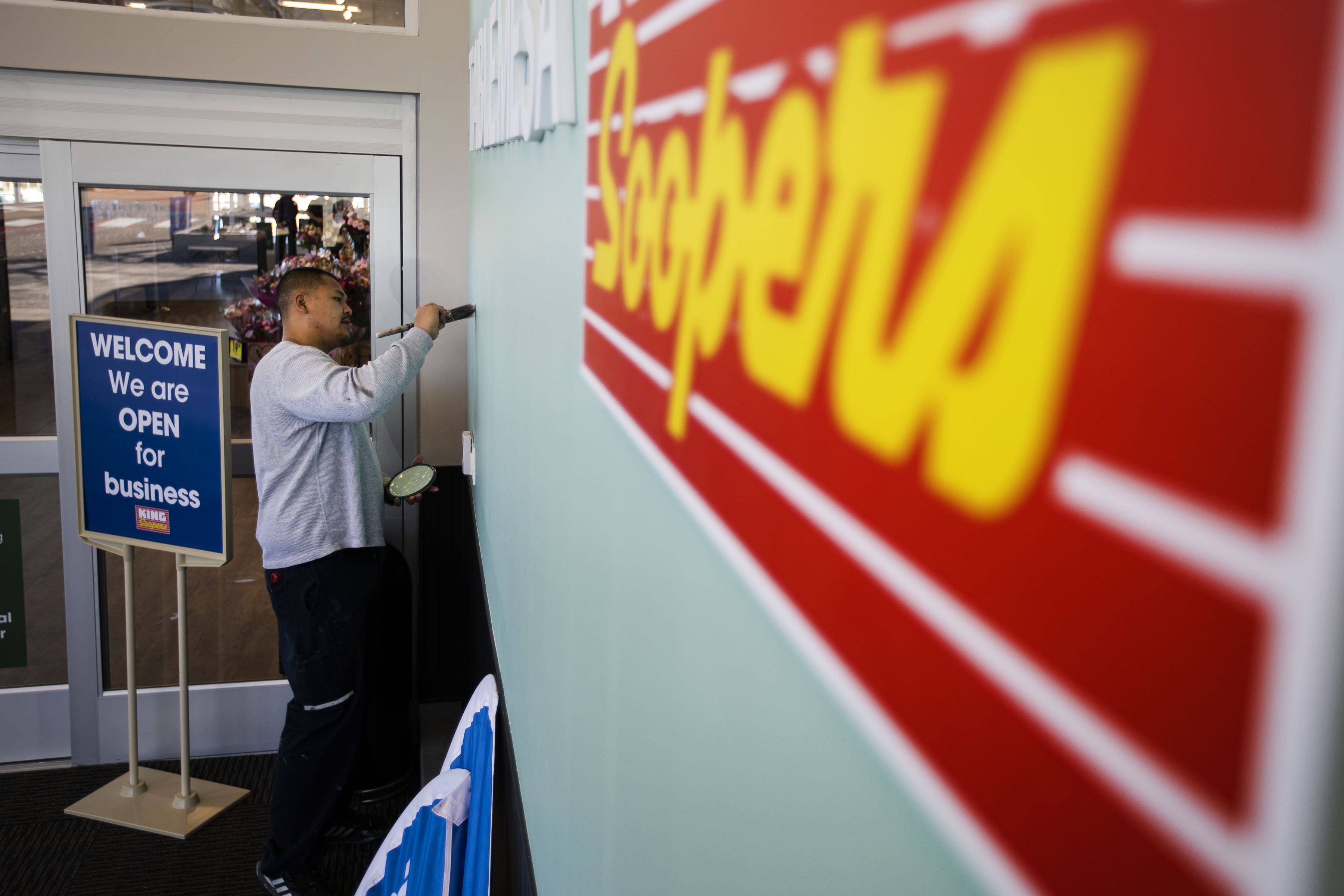FILE PHOTO: A worker does some touch-up painting in one of the main entrances of the King Soopers grocery store in Boulder, Colo. (Timothy Hurst/The Gazette) (Timothy Hurst/Denver Gazette)