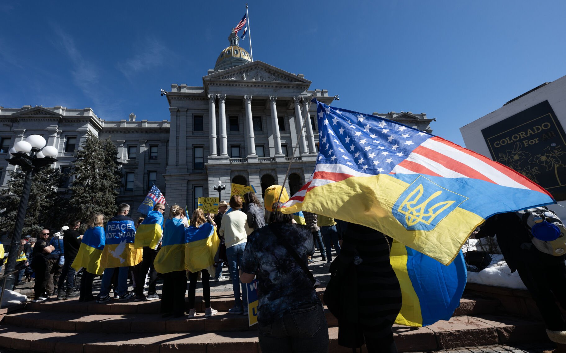 People listen to speakers at the steps of the Colorado State Capitol Sunday, Feb. 23, 2025, in Denver during a Stand for Ukraine Rally on the eve of the third anniversary of Russia's attack on Ukraine. About 1,000 people showed up at the rally organized by Ukrainians of Colorado. (The Gazette, Christian Murdock) (Christian Murdock, The Gazette)
