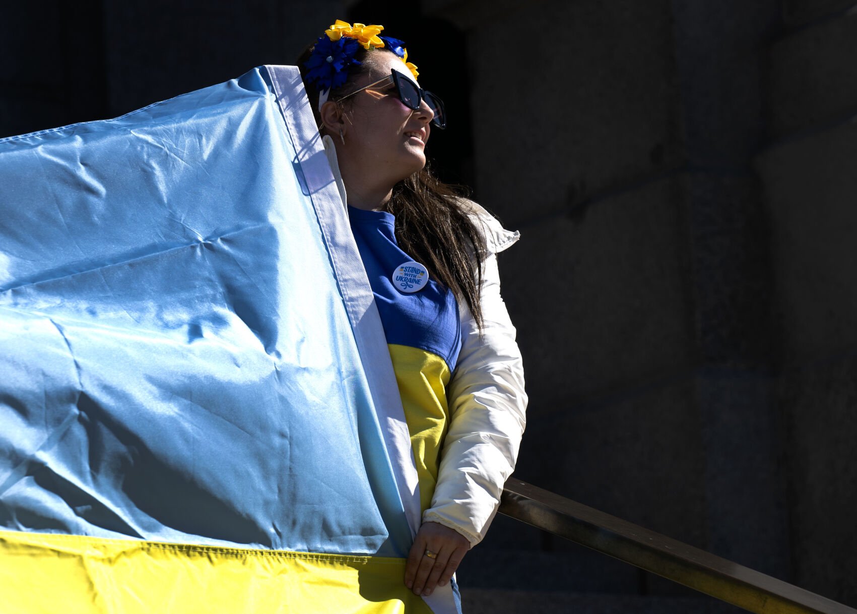 Marina Dubrova, the president of the Ukrainians of Colorado, holds the end of an Ukrainian flag on the steps of Colorado State Capitol Sunday, Feb. 23, 2025, in Denver during a Stand for Ukraine Rally on the eve of the third anniversary of Russia's attack on Ukraine. About 1,000 people showed up for the rally organized by Ukrainians of Colorado. (The Gazette, Christian Murdock) (Christian Murdock, The Gazette)