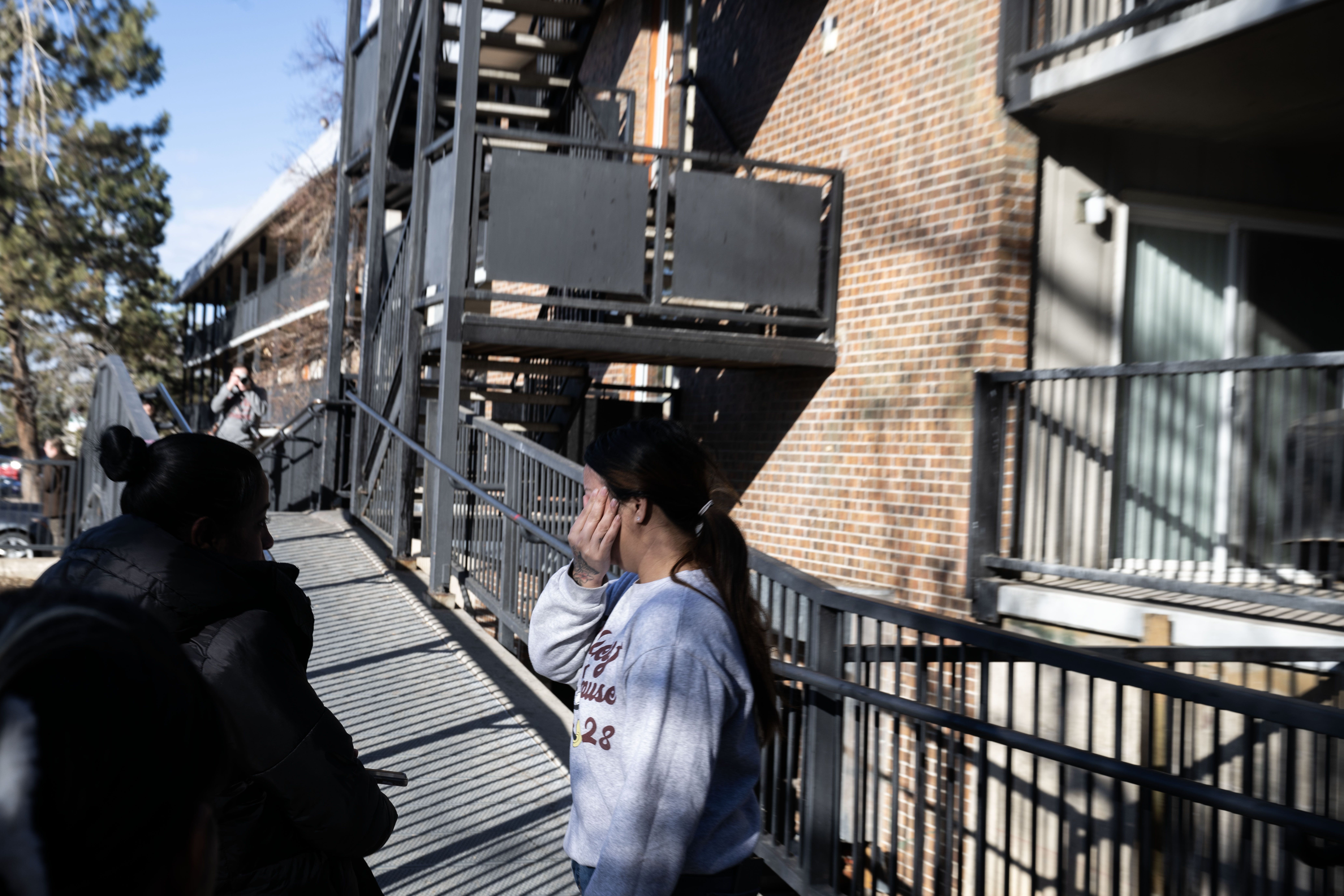A woman cries outside of her apartment building at Cedar Run Apartments in Denver after Drug Enforcement Agency agents executed a warrant in the complex on Wednesday, Feb. 5, 2025. (Stephen Swofford, Denver Gazette) (StephenSwoffordPhotographerstephen.swofford@gazette.comhttps://secure.gravatar.com/avatar/1ddcaf11c5d70eaa58546ddc4e038687?d=mm&r=g)