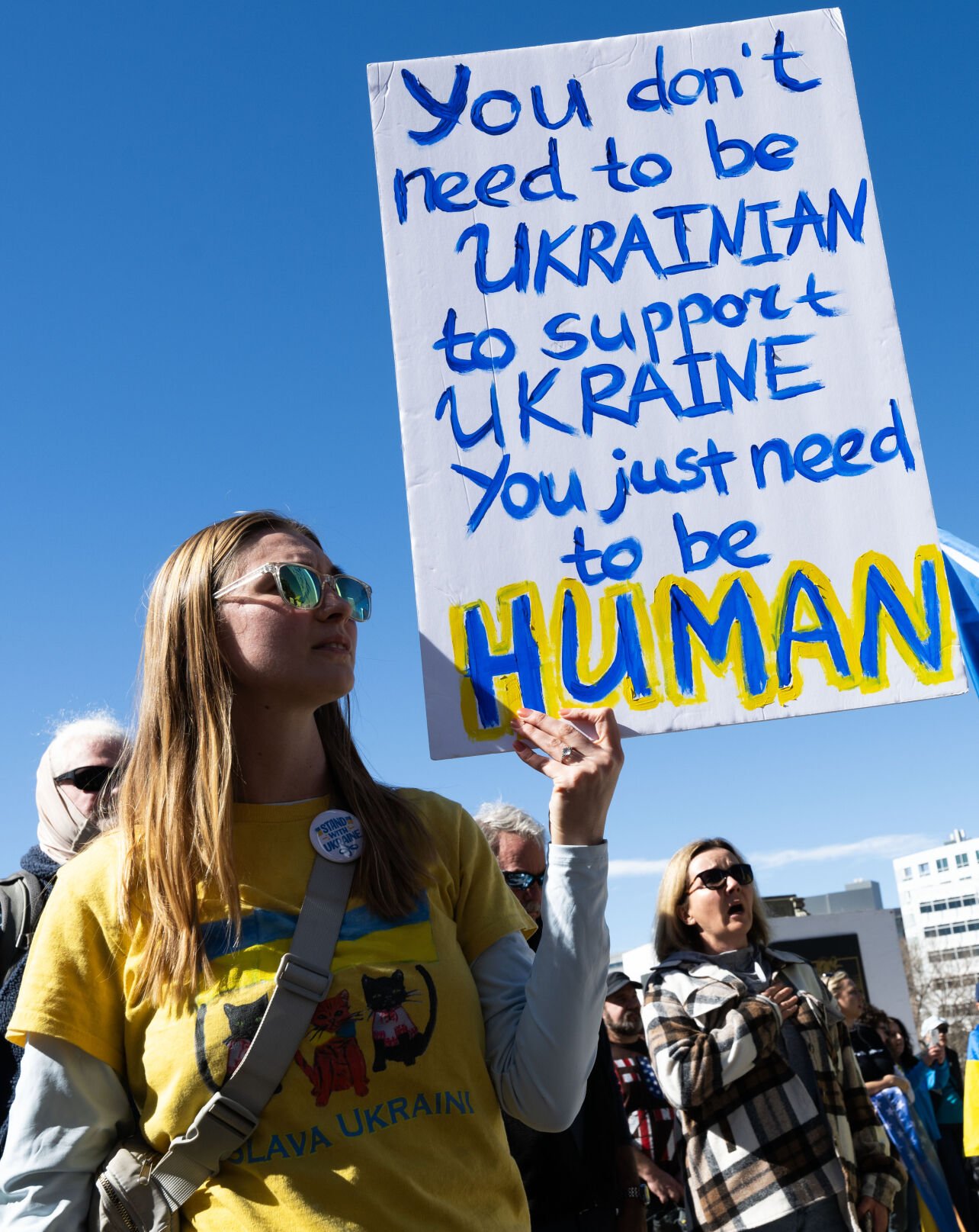 Anya Ruda, who was born in Ukraine and lives in Colorado, holds a sign supporting Ukraine on the step of the Colorado State Capitol Sunday, Feb. 23, 2025, in Denver during a Stand for Ukraine Rally on the eve of the third anniversary of Russia's attack on Ukraine. About 1,000 people attended the rally organized by Ukrainians of Colorado. (The Gazette, Christian Murdock) (Christian Murdock, The Gazette)
