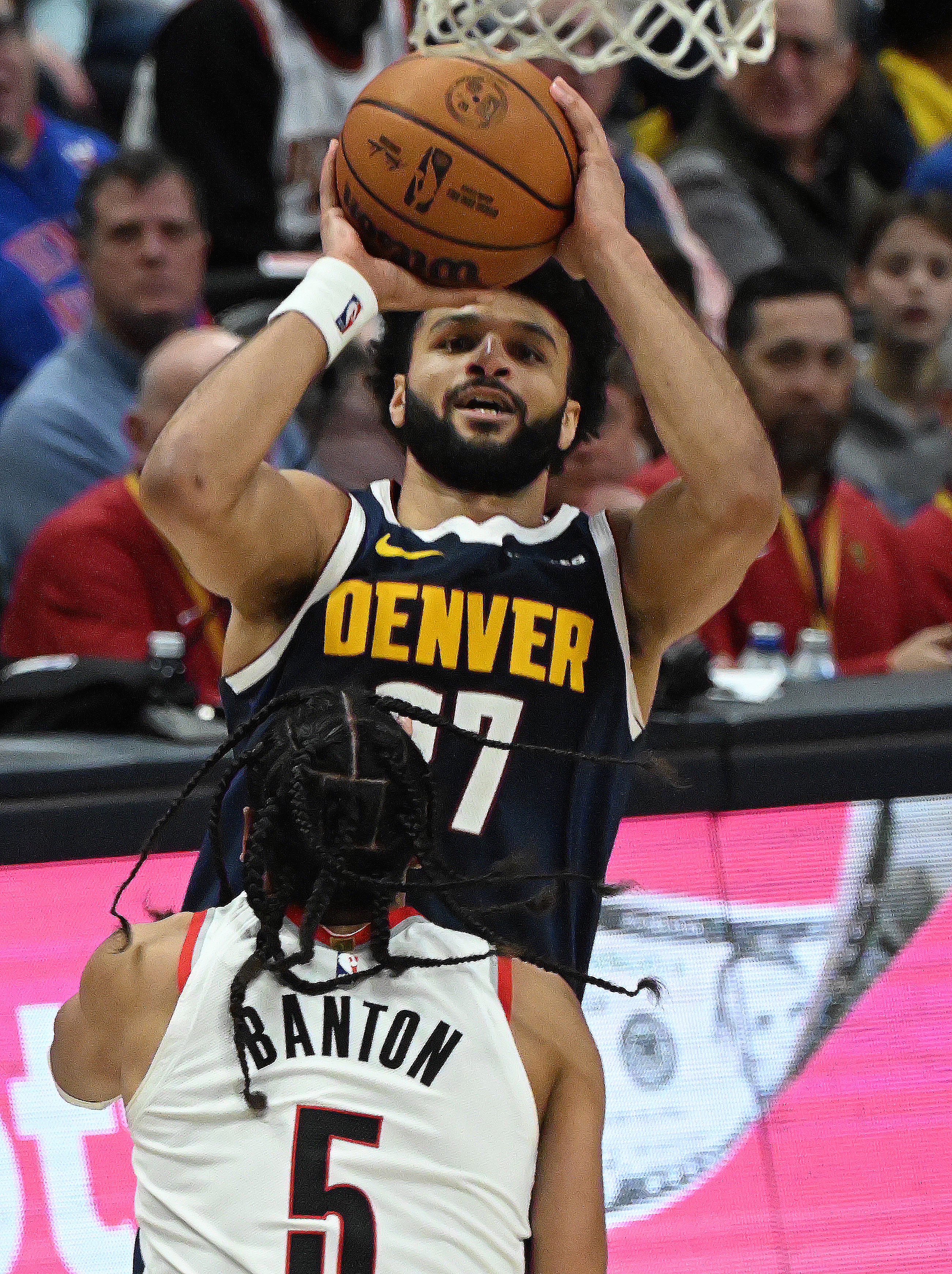 Nuggets fans give Denver Nuggets guard Jamal Murray (27) shoots a basket over Portland Trail Blazers guard Dalano Banton (5) in the 4th quarter during a game at Ball Arena on Wednesday, Feb. 12, 2025. (Jerilee Bennett,The Gazette)