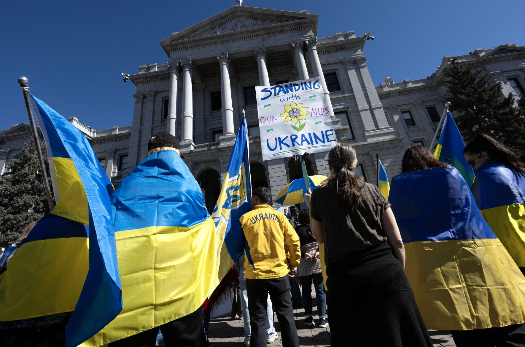 People listen to speakers at the steps of the Colorado State Capitol Sunday, Feb. 23, 2025, in Denver during a Stand for Ukraine Rally on the eve of the third anniversary of Russia's attack on Ukraine. About 1,000 people showed up at the rally organized by Ukrainians of Colorado. (The Gazette, Christian Murdock) (Christian Murdock, The Gazette)