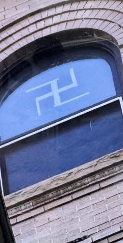 Prior to being smashed, a prominent swastika symbol was visible (copy)