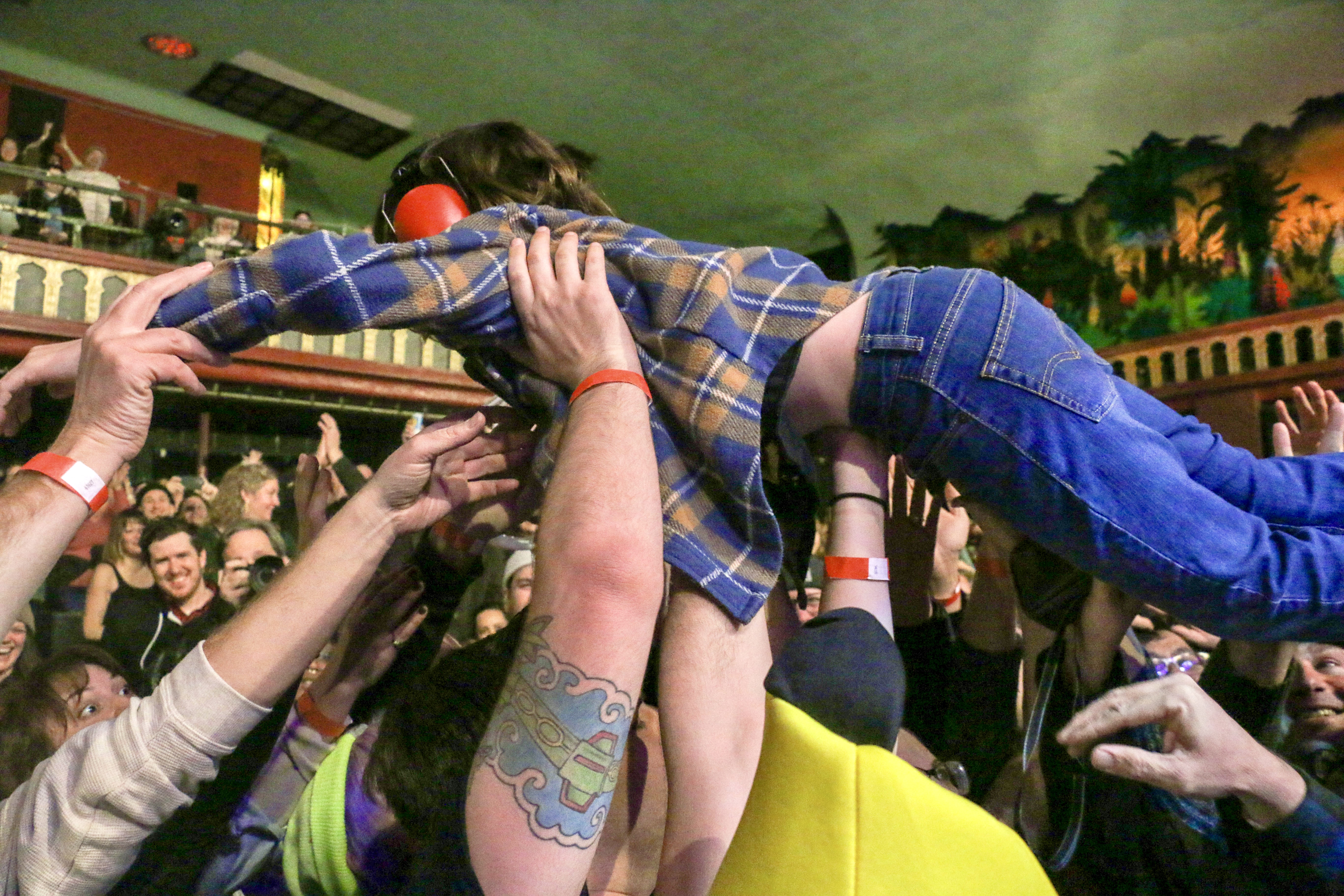 16. Ben Roy of the punk band Spells sends a 9-year-old fan crowd-surfing while opening for Ted Leo and the Pharmacists on Jan. 25, 2025, at the Oriental Theater in northwest Denver. Twenty minutes after the set, Roy was doing a stand-up comedy routine 2 miles east at the Bug Theater, riffing in part on meeting the boy back at the Oriental. (JOHN MOORE/THE DENVER GAZETTE)