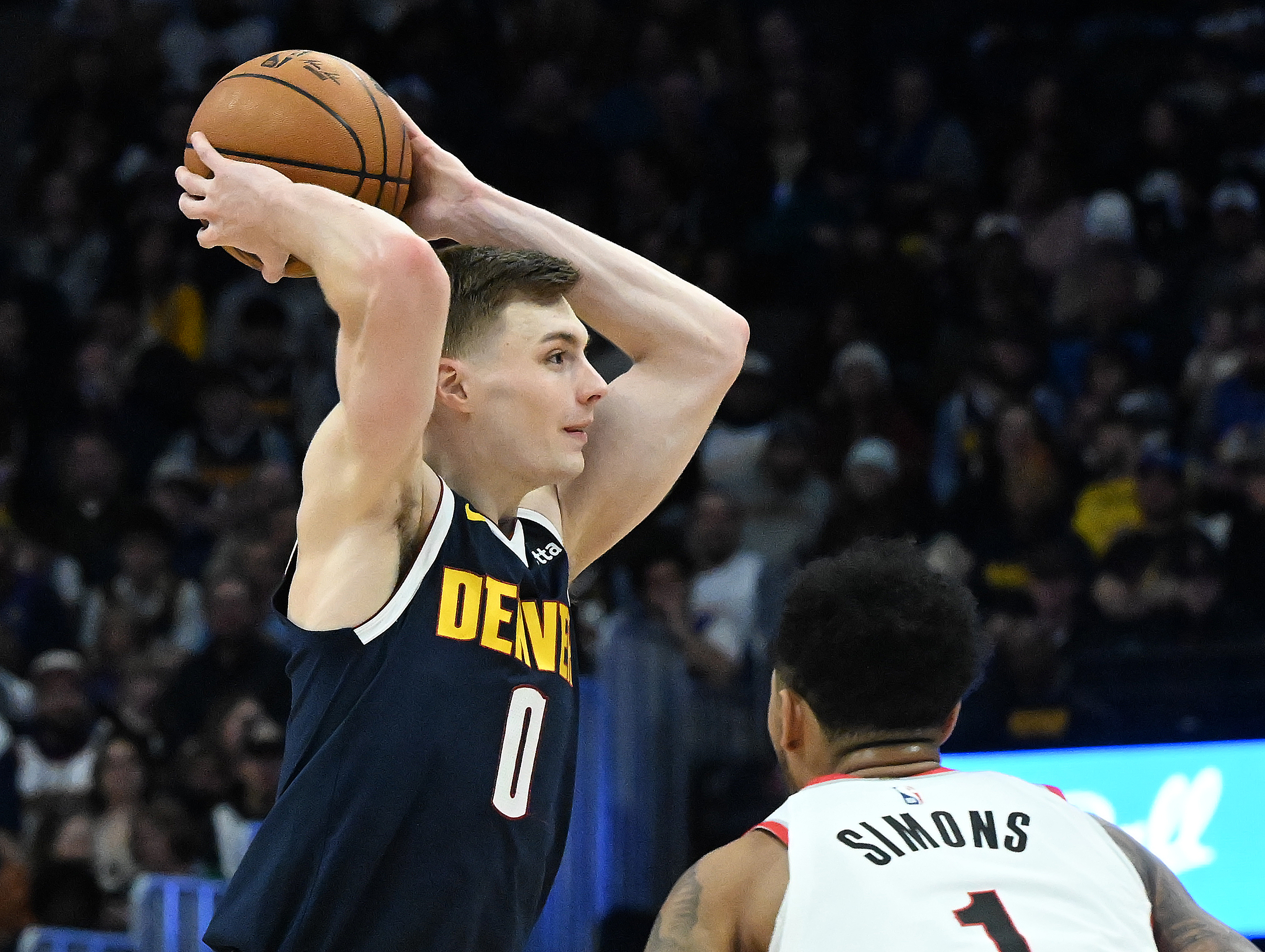 Denver Nuggets guard Christian Braun (0) passes the ball during a game against the Trailblazers at Ball Arena on Wednesday, Feb. 12, 2025. (Jerilee Bennett,The Gazette)