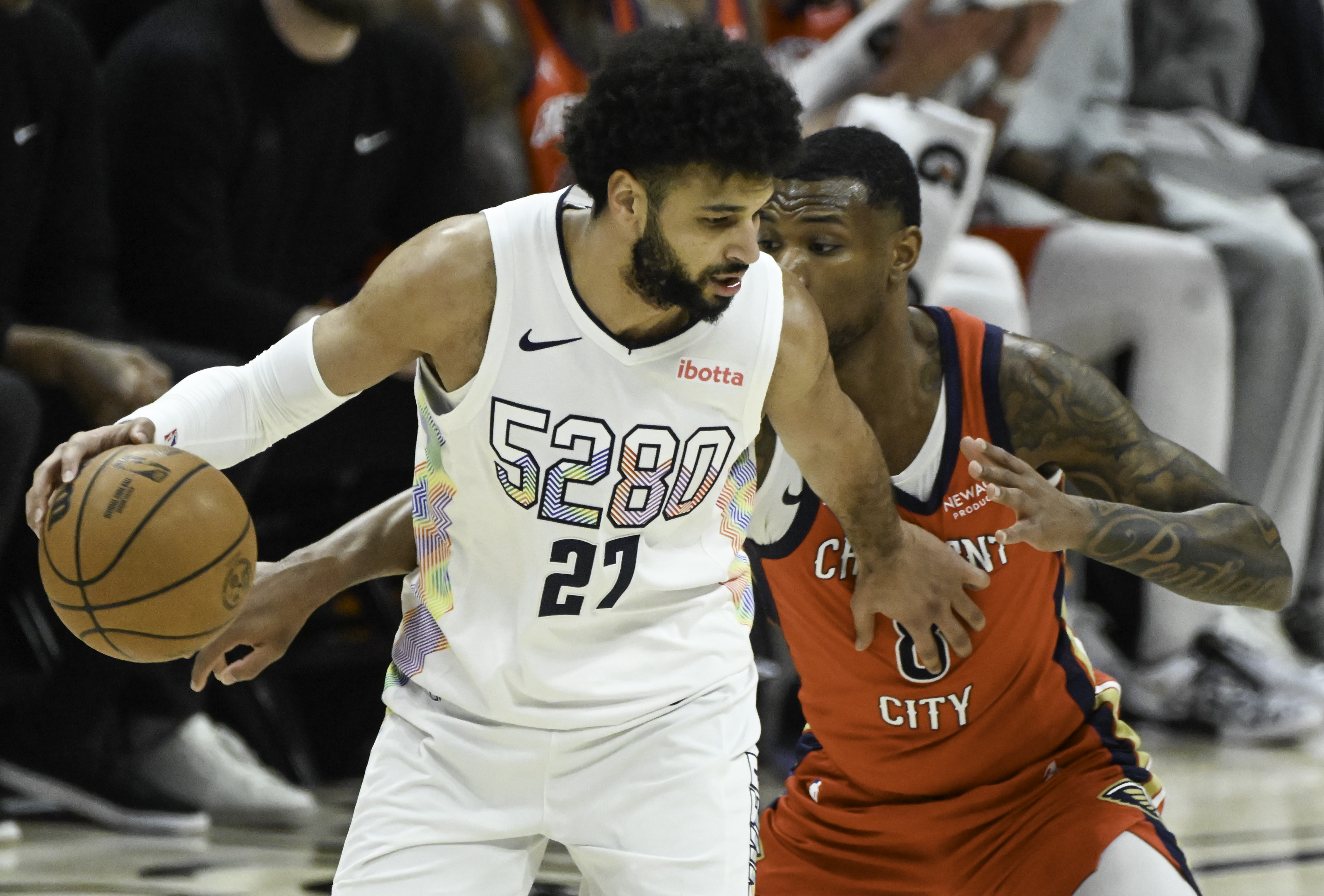 Denver Nuggets guard Jamal Murray (27) is defended by Pelicans Jamal Cain during a game at Ball Arena on Wednesday, Feb. 5, 2025. The Nuggets defeated the Pelicans 144-119. (Jerilee Bennett,The Gazette)