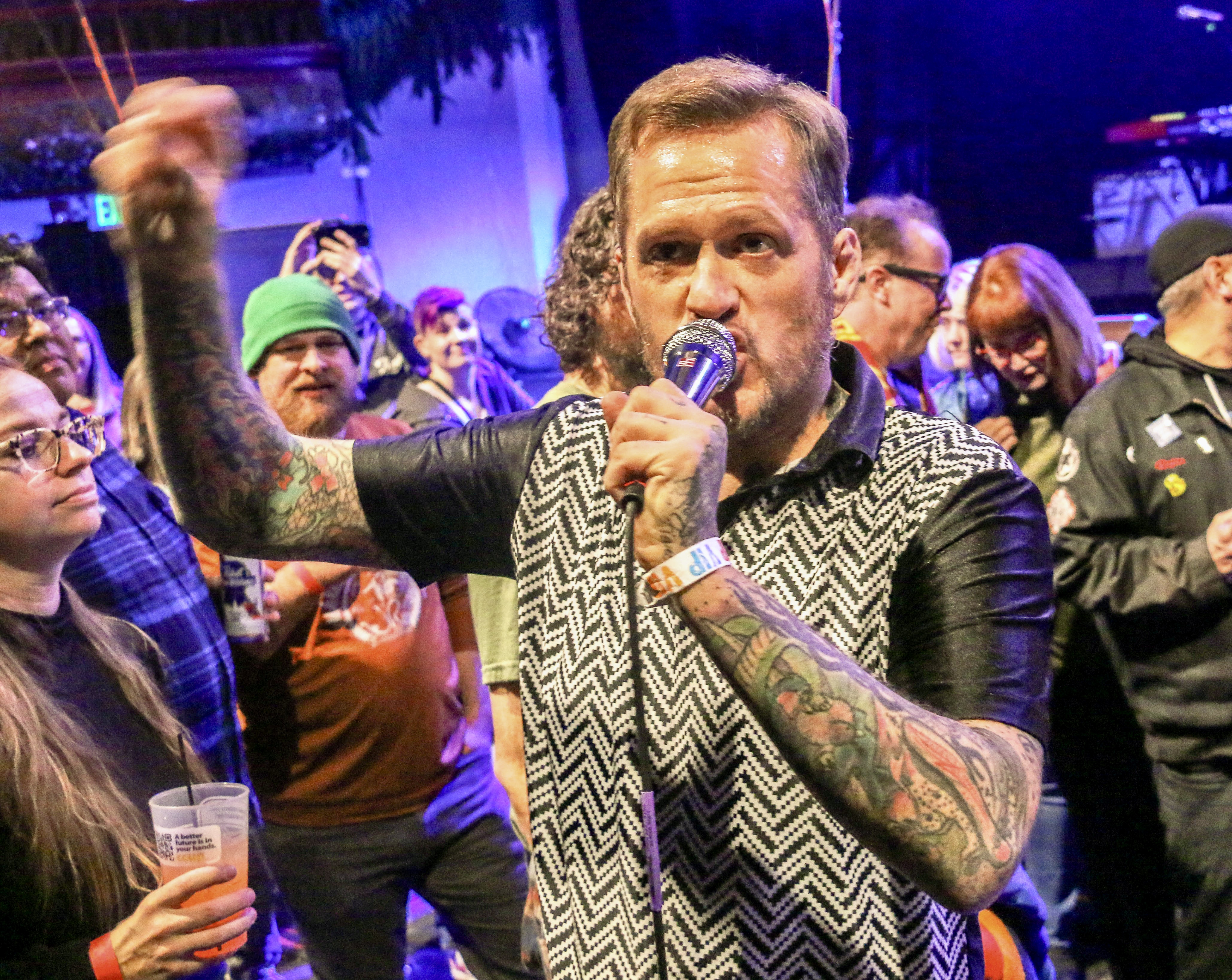 8. Ben Roy of the punk band Spells works the crowd while opening for Ted Leo and the Pharmacists on Jan. 25, 2025, at the Oriental Theater in northwest Denver. Twenty minutes after the set, Roy was doing a stand-up comedy routine 2 miles east at the Bug Theater, riffing in part on what had just happened at the Oriental. (JOHN MOORE/THE DENVER GAZETTE)
