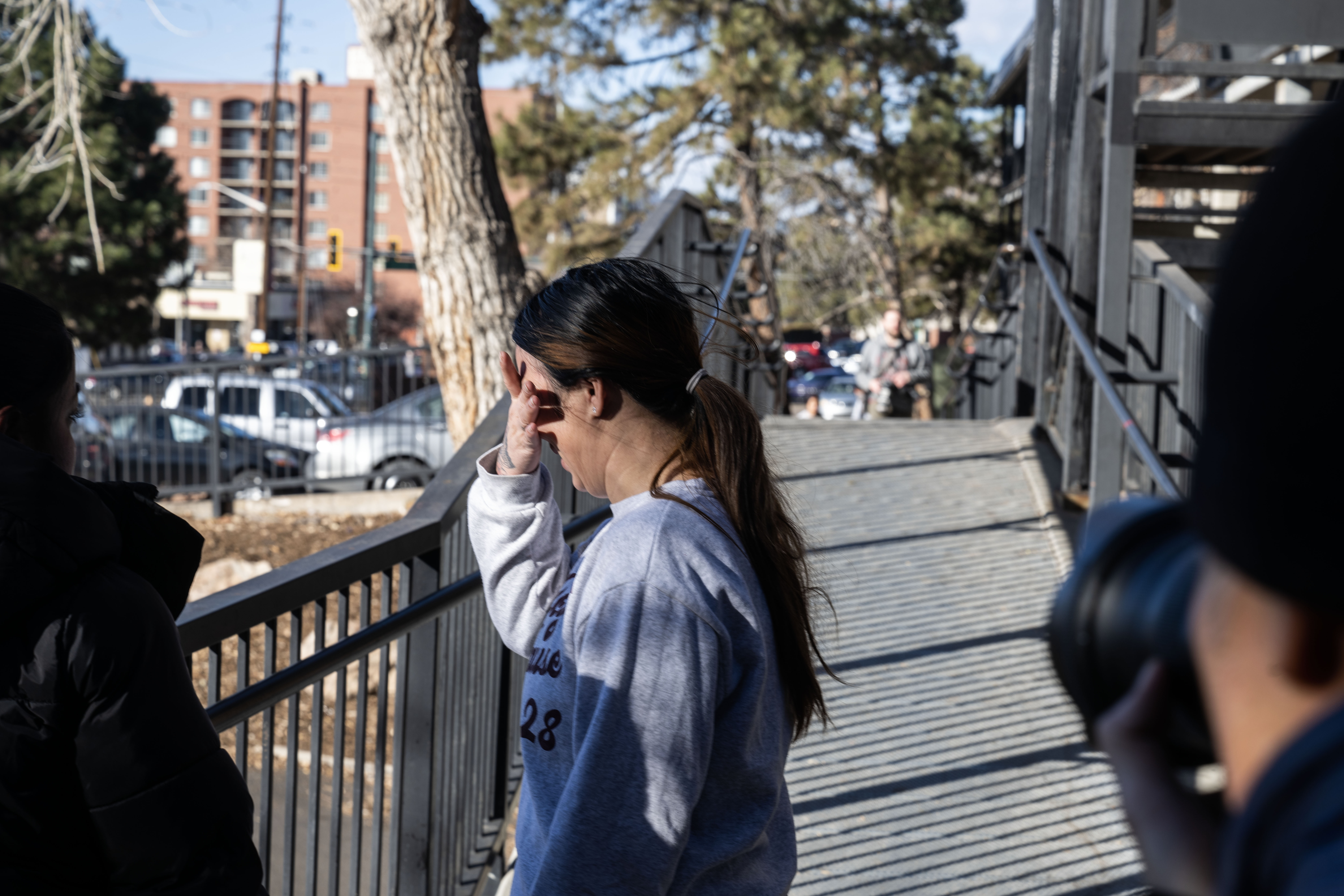 A woman cries outside of her apartment building at Cedar Run Apartments in Denver after Federal agents executed an ICE warrant in the complex on Wednesday, Feb. 5, 2025. (Stephen Swofford, Denver Gazette) (StephenSwoffordPhotographerstephen.swofford@gazette.comhttps://secure.gravatar.com/avatar/1ddcaf11c5d70eaa58546ddc4e038687?d=mm&r=g)