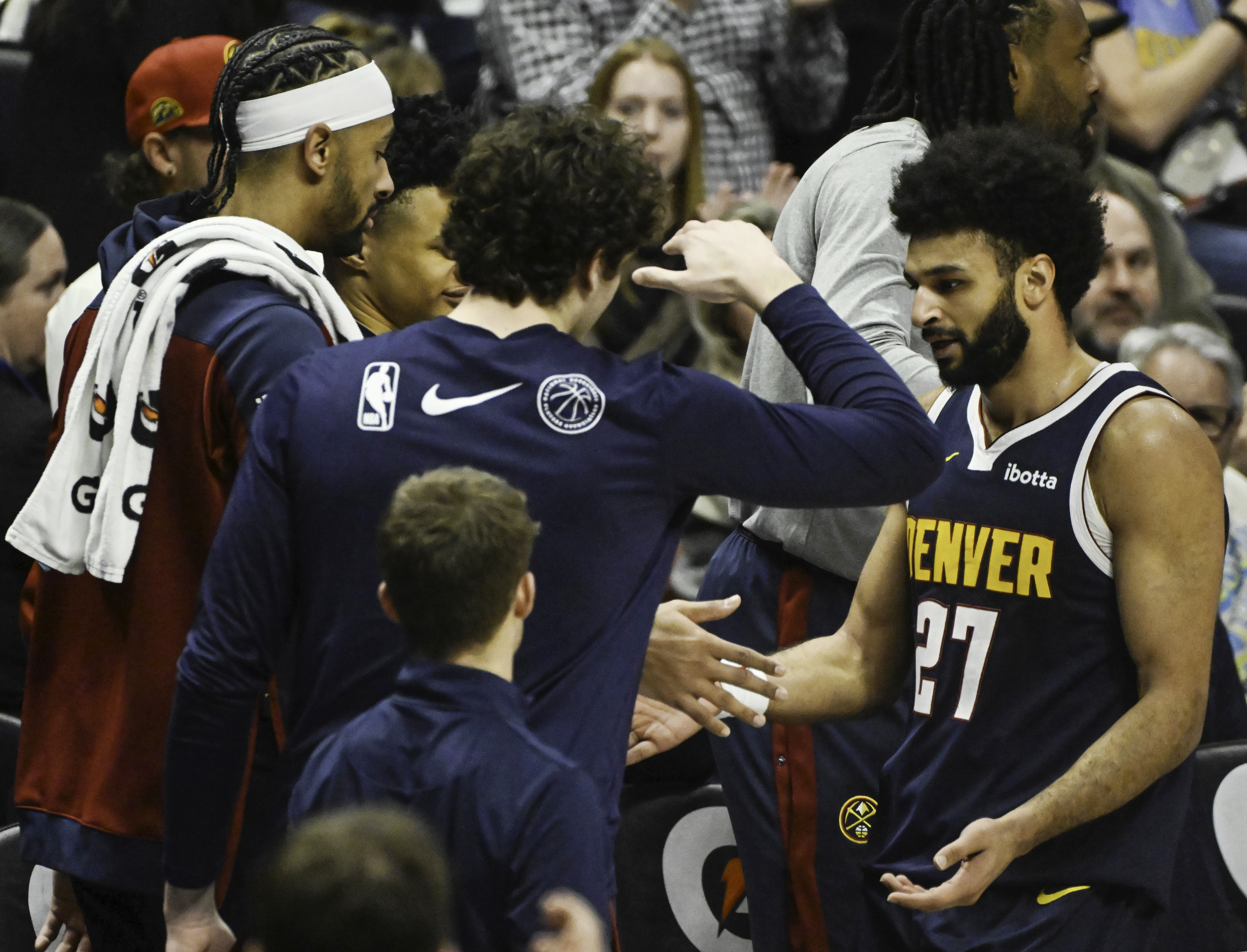 Nuggets fans give Denver Nuggets guard Jamal Murray (27) is congratulated at the end of the 3rd quarter when he ended the quarter with 49 points during a game at Ball Arena on Wednesday, Feb. 12, 2025. Murray scored a career high of 55 points in the game to lead the Nuggets to a 132-121 win over the Trailblazers. (Jerilee Bennett, The Gazette)