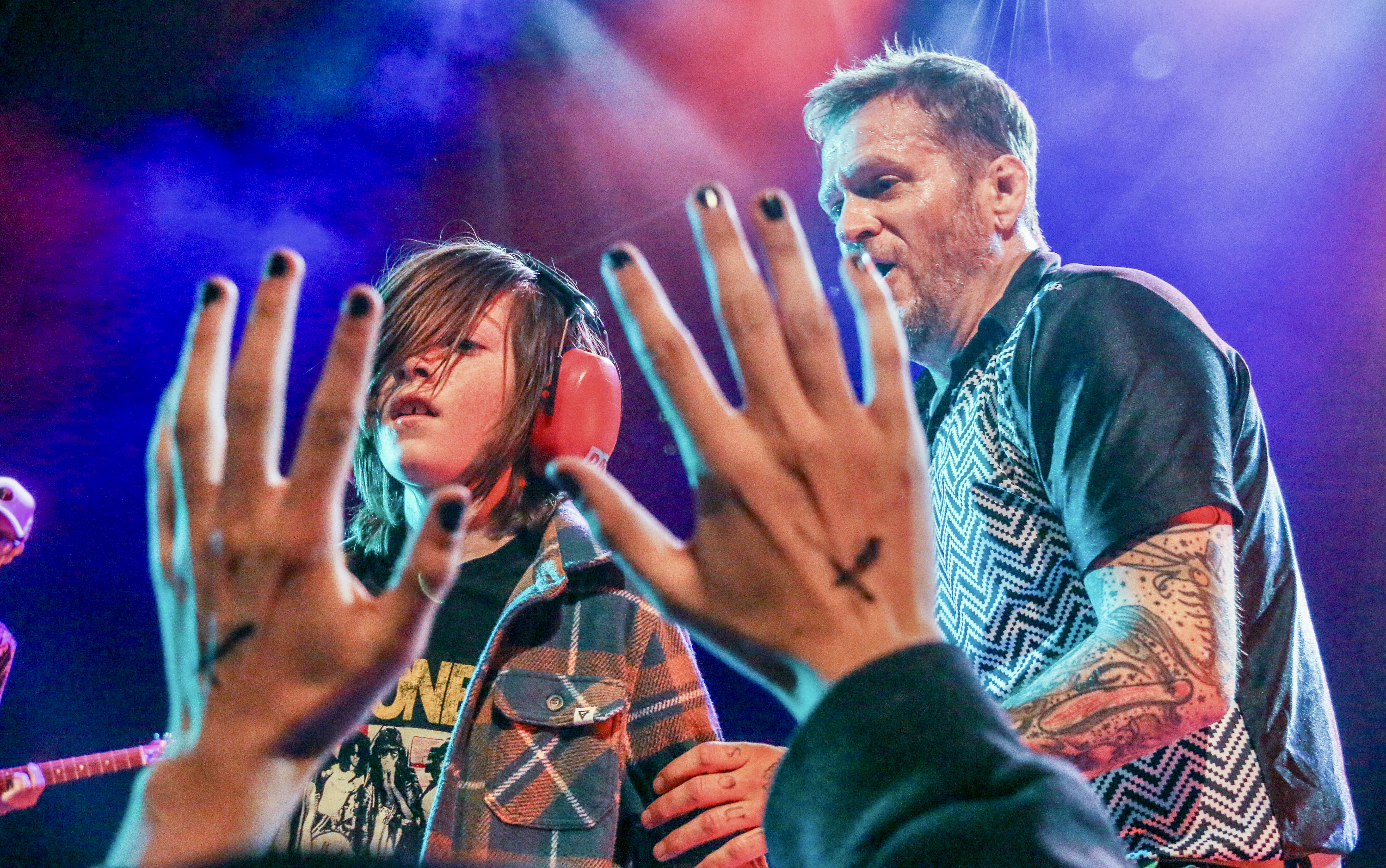 15. Ben Roy of the punk band Spells interacts with a 9-year-old fan while opening for Ted Leo and the Pharmacists on Jan. 25, 2025, at the Oriental Theater in northwest Denver. Twenty minutes after the set, Roy was doing a stand-up comedy routine 2 miles east at the Bug Theater, riffing in part on meeting the boy back at the Oriental. (JOHN MOORE/THE DENVER GAZETTE)