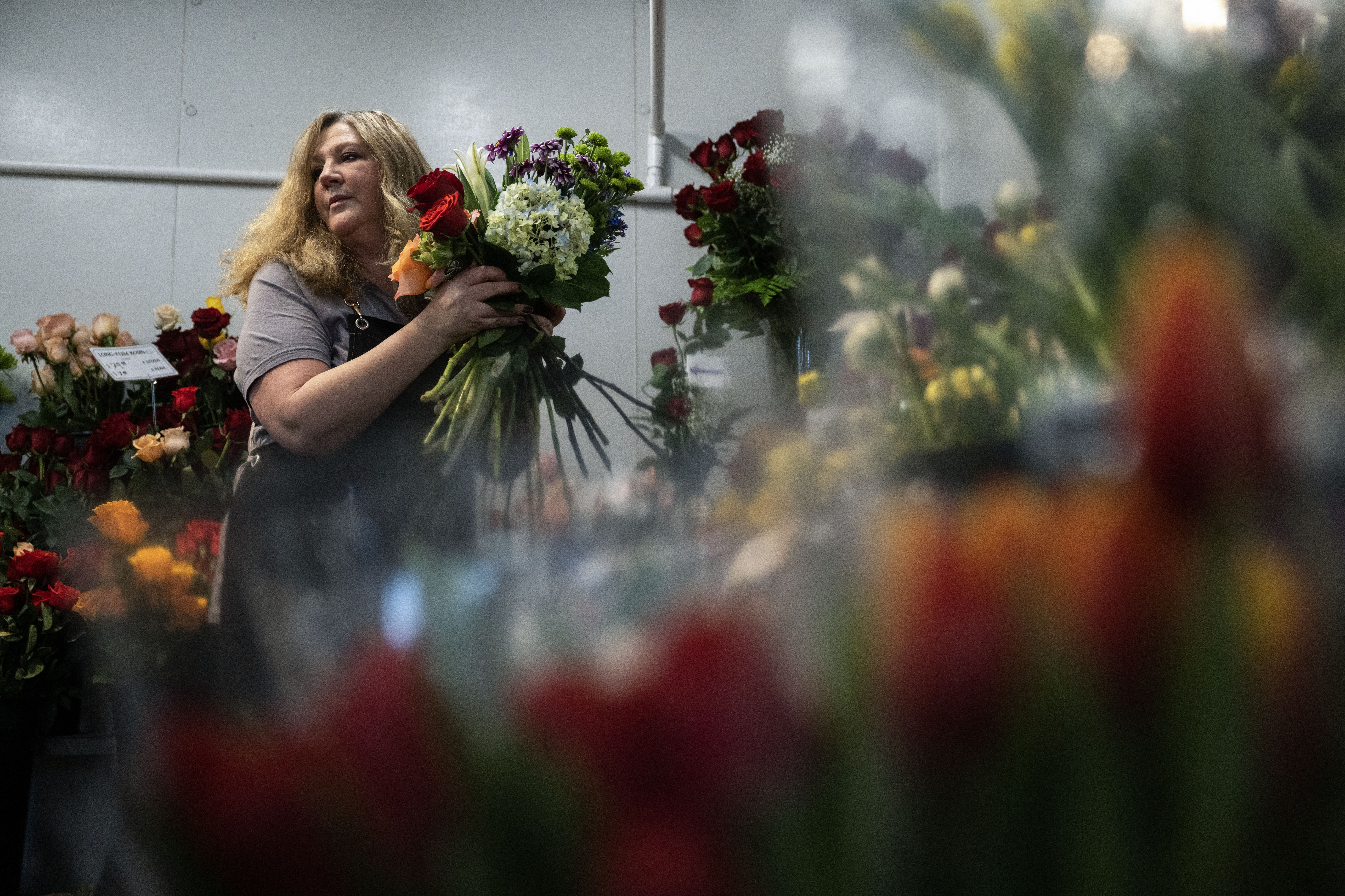 Morgan Marcove gathers flowers for an arrangement as she helps prepare for Valentine’s Day at Bonnie Brae flowers in Denver on Thursday, Feb. 13, 2025. (Stephen Swofford, Denver Gazette) (StephenSwoffordPhotographerstephen.swofford@gazette.comhttps://secure.gravatar.com/avatar/1ddcaf11c5d70eaa58546ddc4e038687?d=mm&r=g)