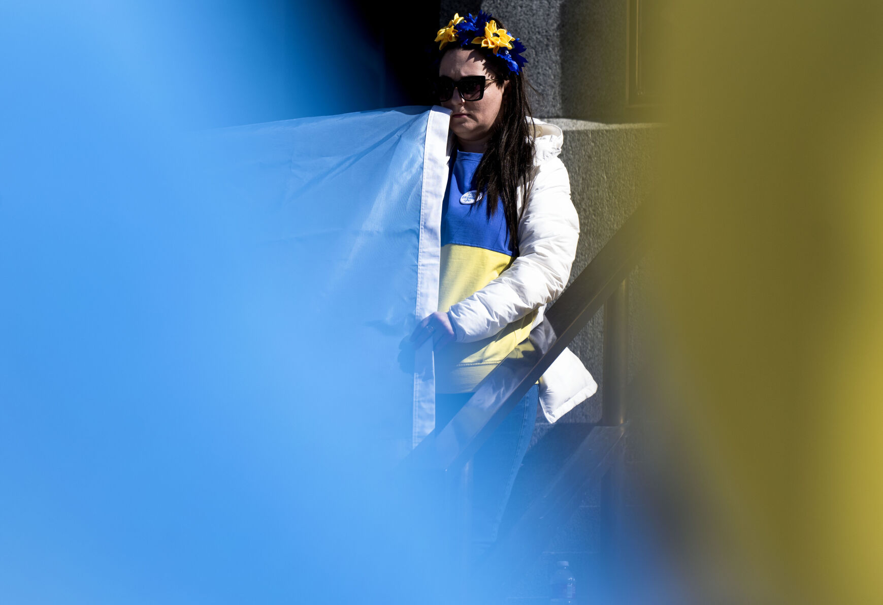 Marina Dubrova, the president of the Ukrainians of Colorado, holds the end of an Ukrainian flag on the steps of Colorado State Capitol Sunday, Feb. 23, 2025, in Denver during a Stand for Ukraine Rally on the eve of the third anniversary of Russia's attack on Ukraine. About 1,000 people showed up for the rally organized by Ukrainians of Colorado. (The Gazette, Christian Murdock) (Christian Murdock, The Gazette)