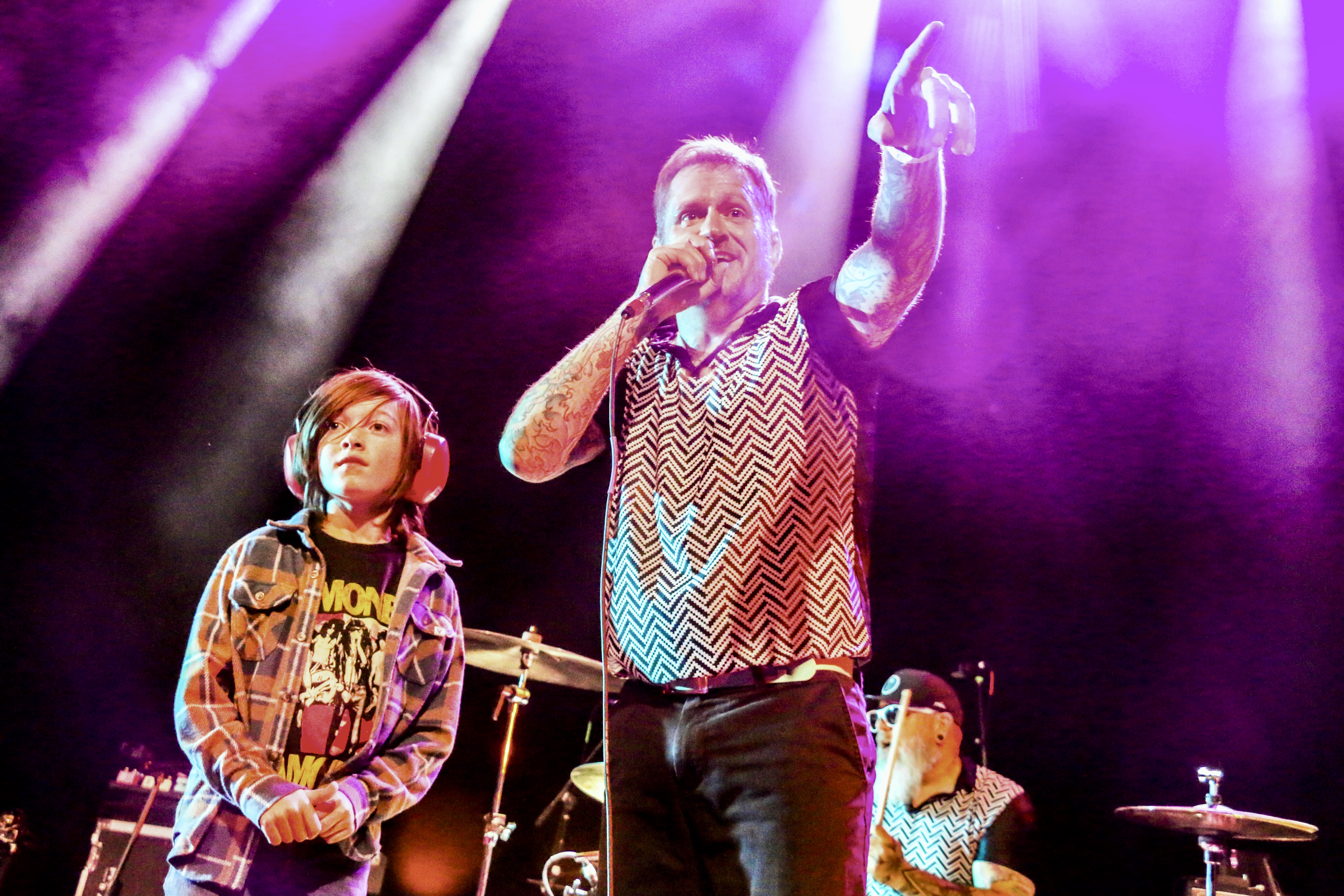 14. Ben Roy of the punk band Spells interacts with a 9-year-old fan while opening for Ted Leo and the Pharmacists on Jan. 25, 2025, at the Oriental Theater in northwest Denver. Twenty minutes after the set, Roy was doing a stand-up comedy routine 2 miles east at the Bug Theater, riffing in part on meeting the boy back at the Oriental. (JOHN MOORE/THE DENVER GAZETTE)