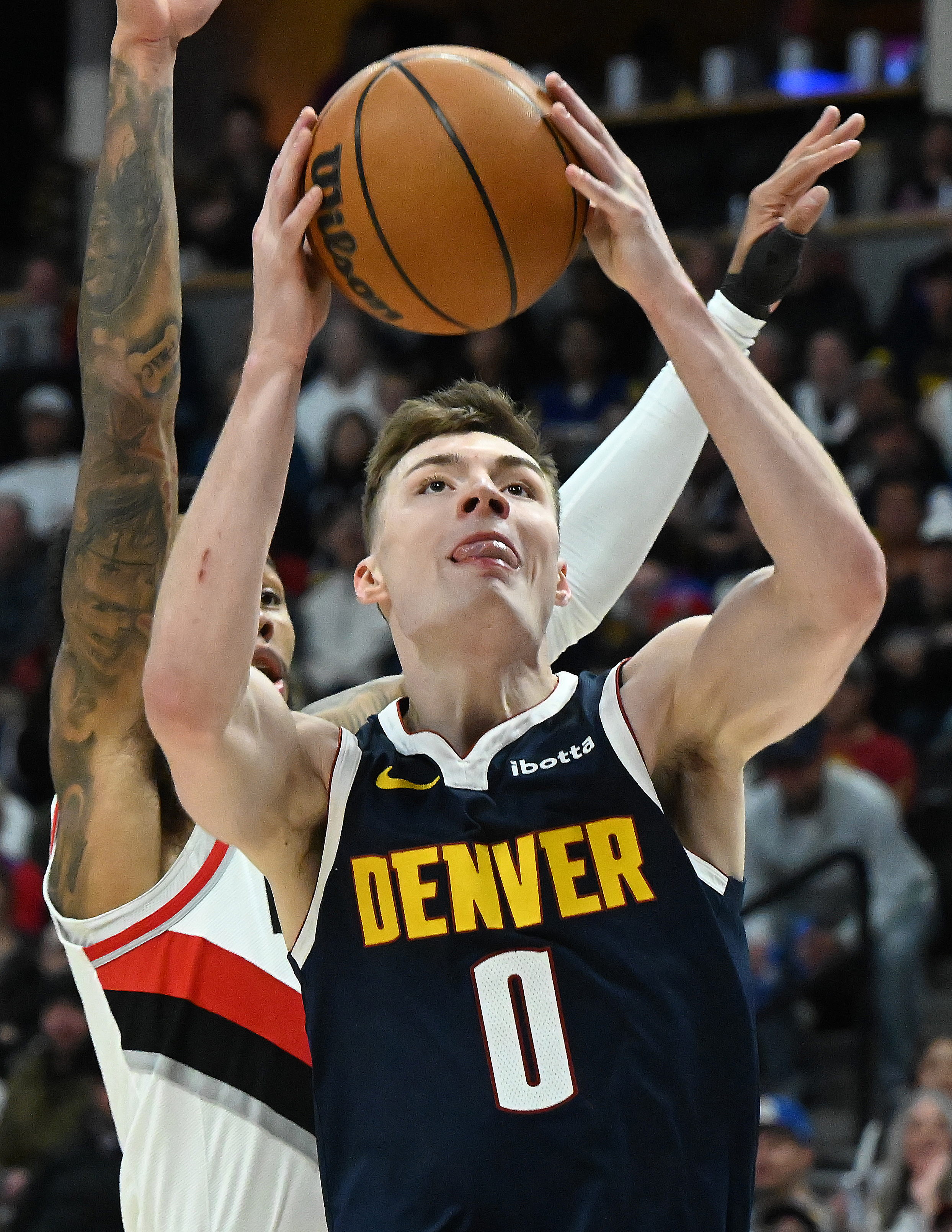 Denver Nuggets guard Christian Braun (0) shoots the ball during a game against the Trailblazers at Ball Arena on Wednesday, Feb. 12, 2025. (Jerilee Bennett,The Gazette)