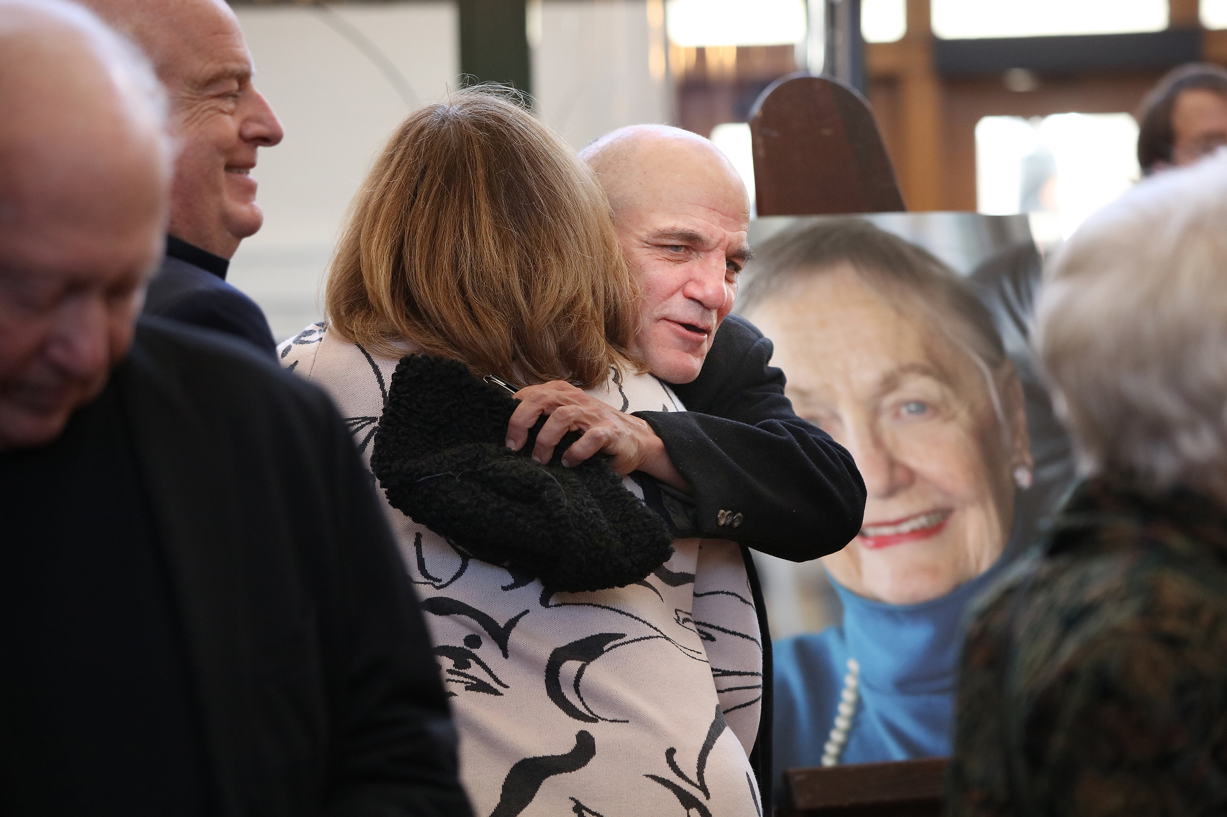 Duke Crawford embraces an attendee during the memorial service for his mother Dana Crawford at Union Station in Downtown Denver, Colo., Sunday . Feb. 23, 2025. Crawford is considered to be one of the most influential preservationist and developers in Downtown Denver city’s history. (Photo by Bear Gutierrez) (Bear Gutierrez)