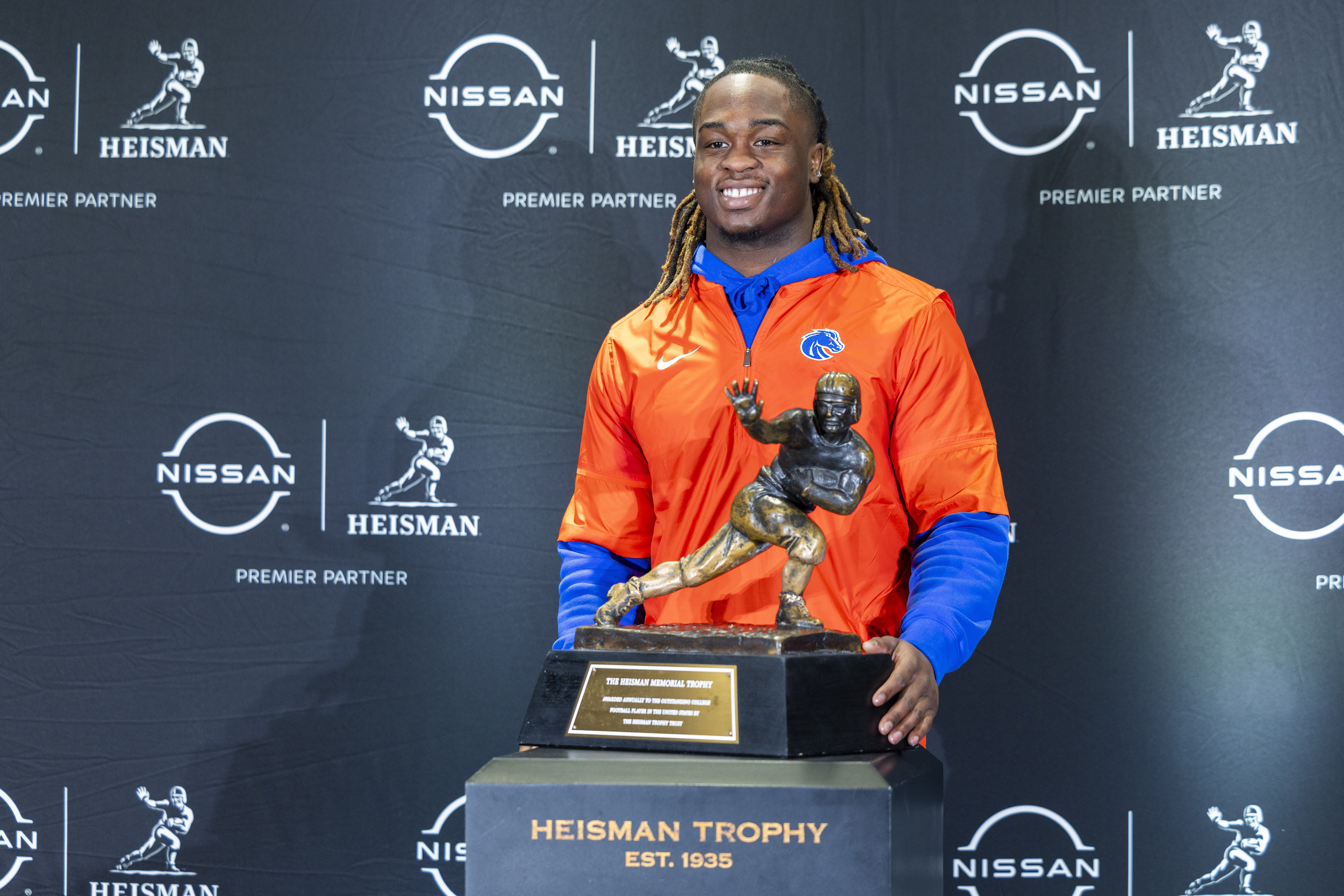 FILE - Heisman Trophy finalist Ashton Jeanty, of Boise State, poses with the trophy during a college football media availability, Friday, Dec. 13, 2024, in New York. (AP Photo/Corey Sipkin, File) (Corey Sipkin)