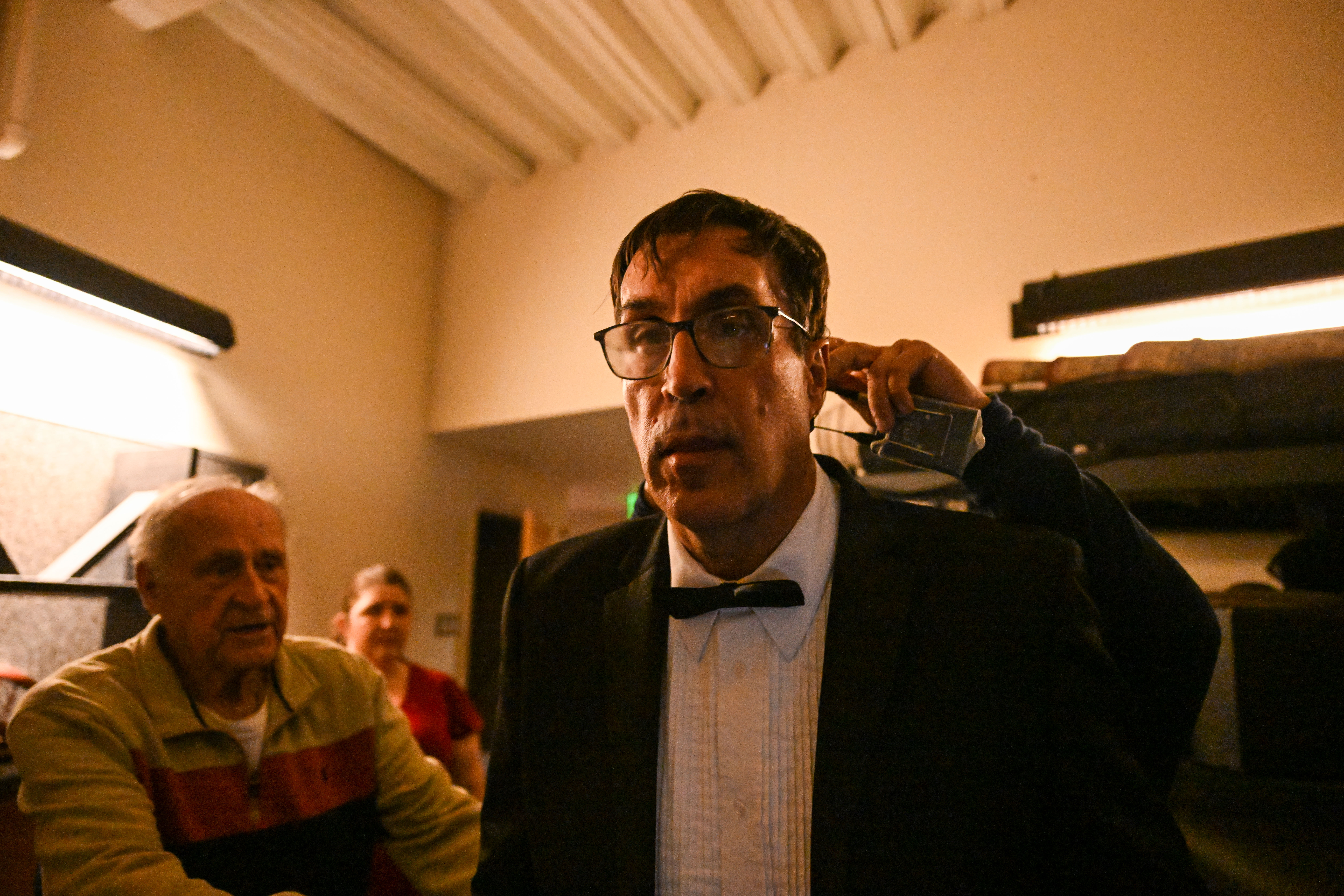 Ed Reinhardt gets his microphone put on his ears as he prepares to go on stage for a dress rehearsal during his 27th and final performance of “Magic Moments” in Englewood on Wednesday, March 26, 2025. (Stephen Swofford, Denver Gazette) (StephenSwoffordPhotographerstephen.swofford@gazette.comhttps://secure.gravatar.com/avatar/1ddcaf11c5d70eaa58546ddc4e038687?d=mm&r=g)