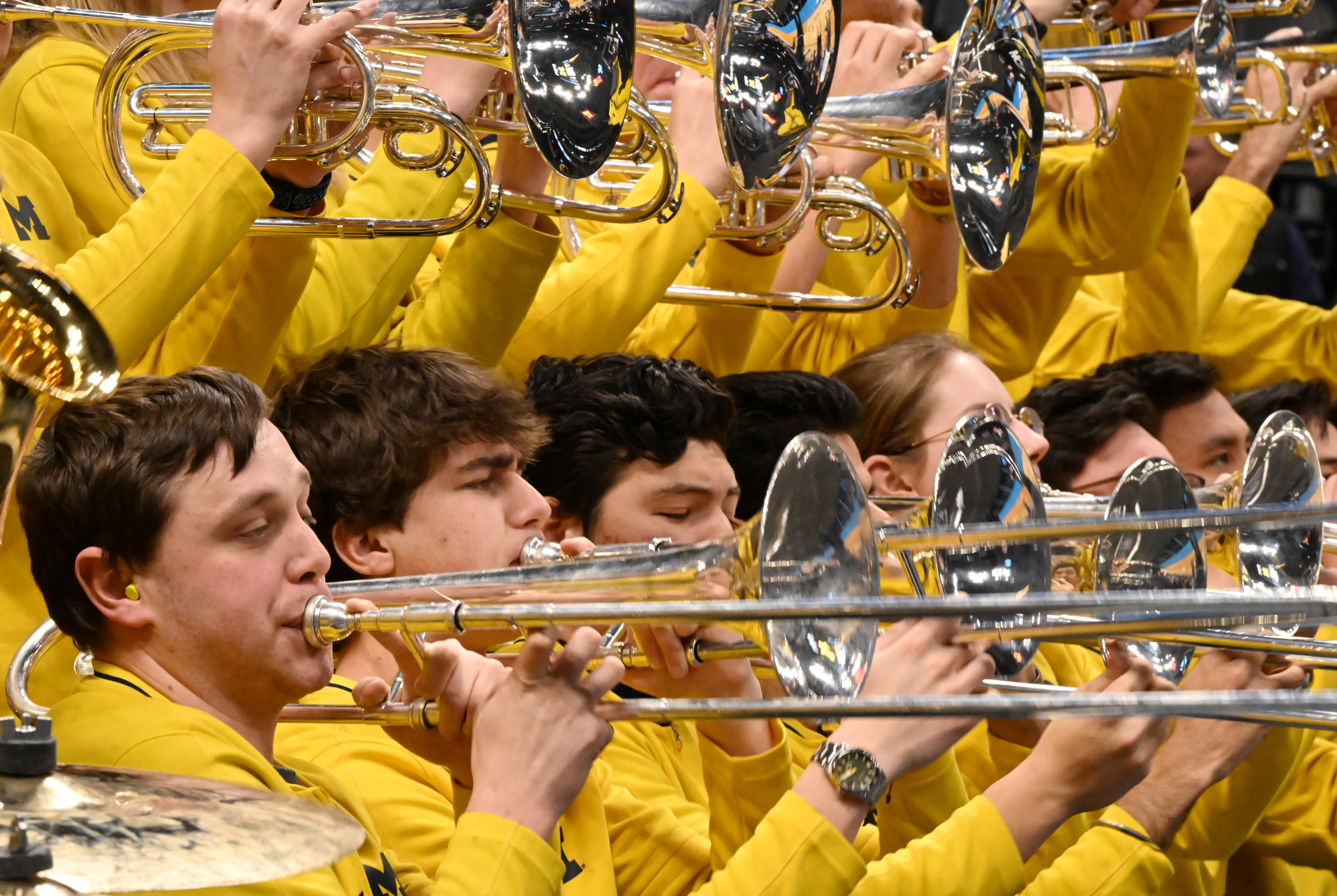 Members of the Michigan band practice while their basketball team practices at Ball Arena on Wednesday, March 19, 2025. Eight collegiate basketball teams are in Denver for the first and second round of the NCAA March Madness basketball tournament to determine the national champion.There will be four games in the first round on Thursday and the four winners will play Saturday at Ball Arena to see who goes to the next round. (Jerilee Bennett,The Gazette)