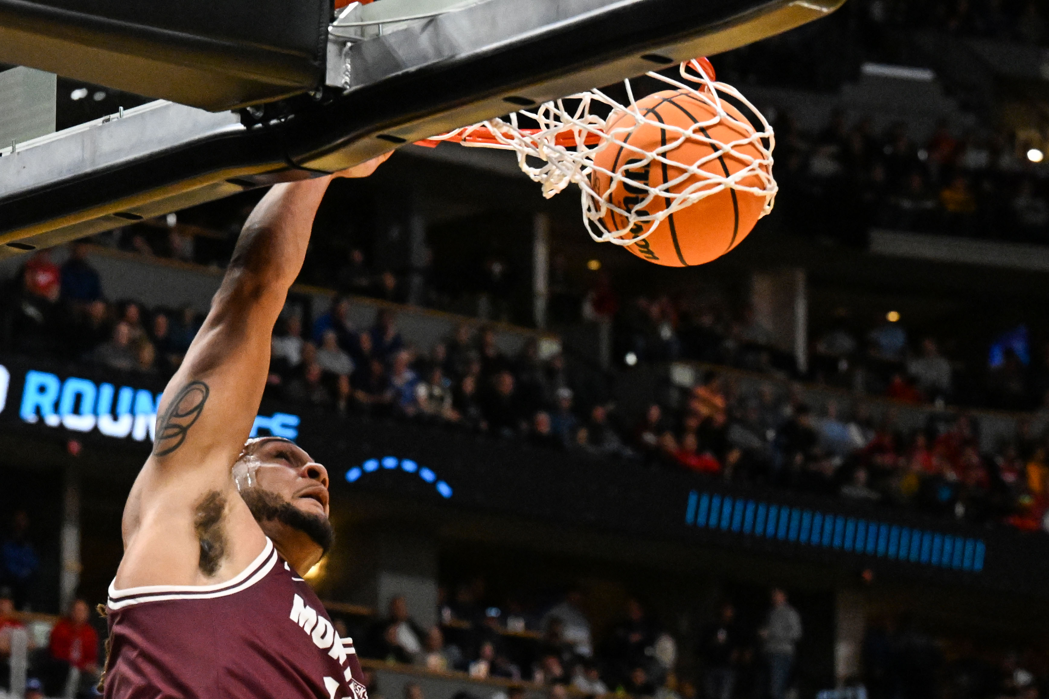 Montana Grizzlies guard Joe Pridgen (11) dunks the ball during the first half of Montana vs Wisconsin during NCAA March Madness on Thursday, March 20, 2025 (Stephen Swofford, Denver Gazette) (StephenSwoffordPhotographerstephen.swofford@gazette.comhttps://secure.gravatar.com/avatar/1ddcaf11c5d70eaa58546ddc4e038687?d=mm&r=g)