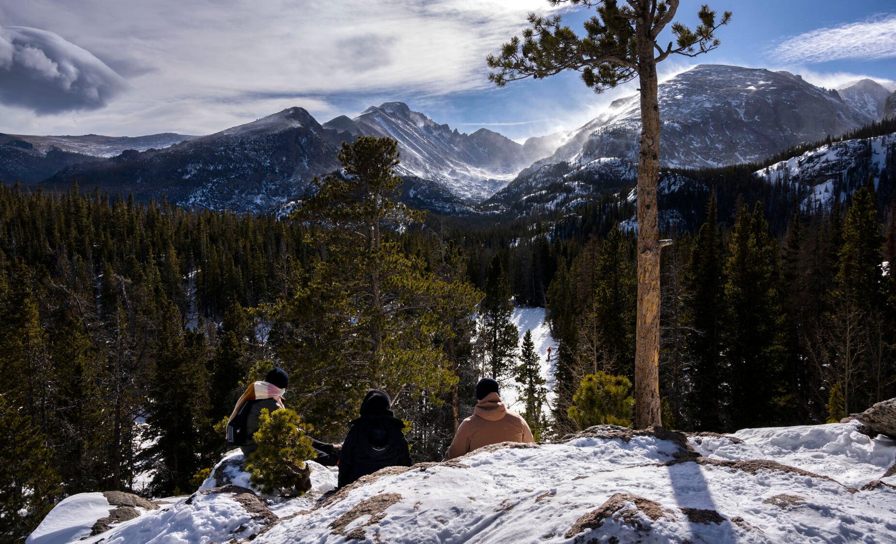 Visitors enjoy the view from above Nymph Lake in Rocky Mountain National Park on Jan. 8, 2023. (Christian Murdock, The Gazette)
